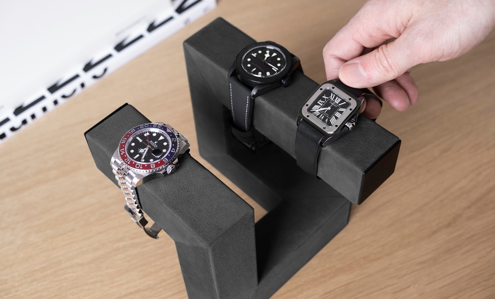 hudson 3, luxury and designer watch stand for 3 timepieces shot on the tabletop with 3 watches 