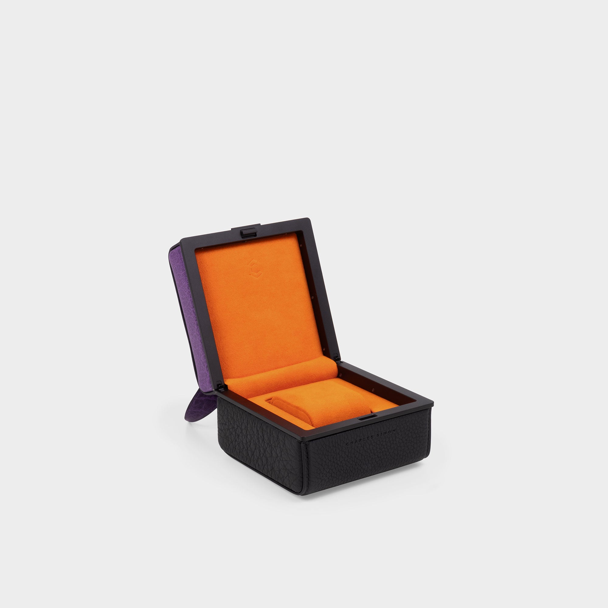 Product photo of open purple dragon Eaton 1 special edition watch case revealing the bright papaya Alcantara interior of the watch case.