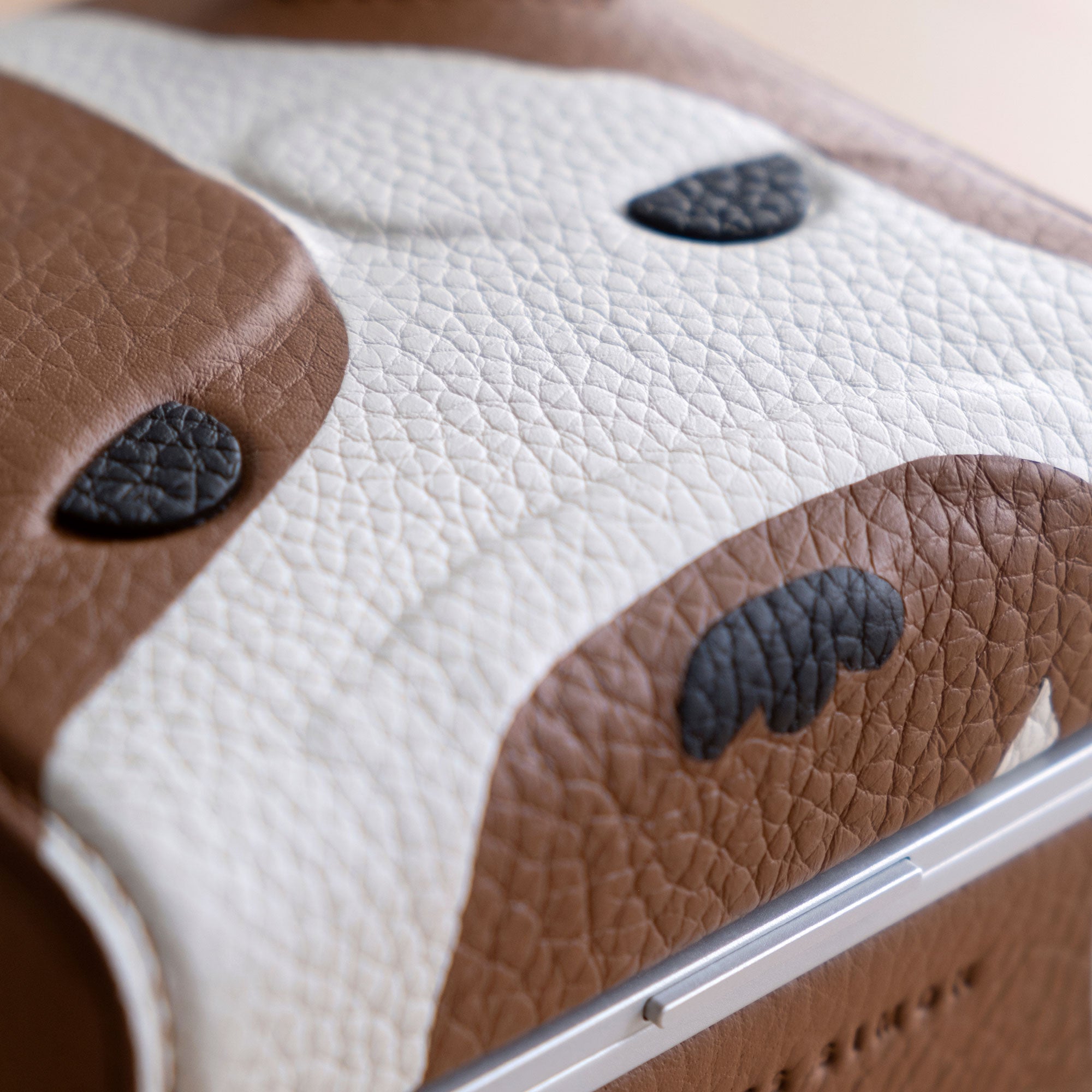 Detail photo of the face of the Bulldog Special Edition Eaton 1 Watch case. Handmade from French leather using advanced leather working techniques, including leather inlays and embossing.