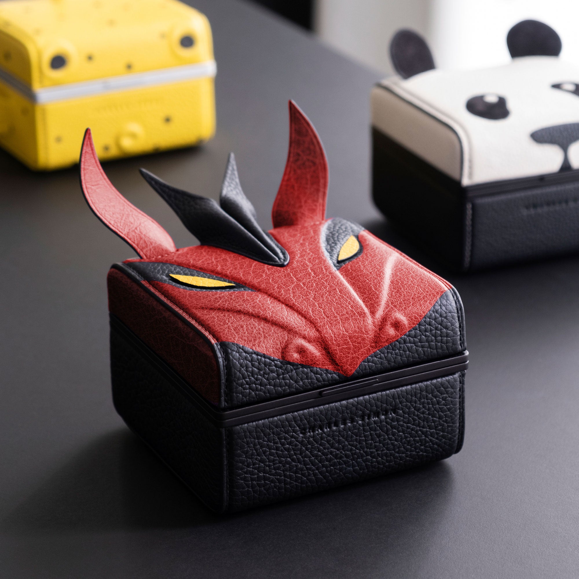 Red dragon Eaton 1 special edition Watch case surrounded by other animal special edition watch cases. All products are handmade in Canada.