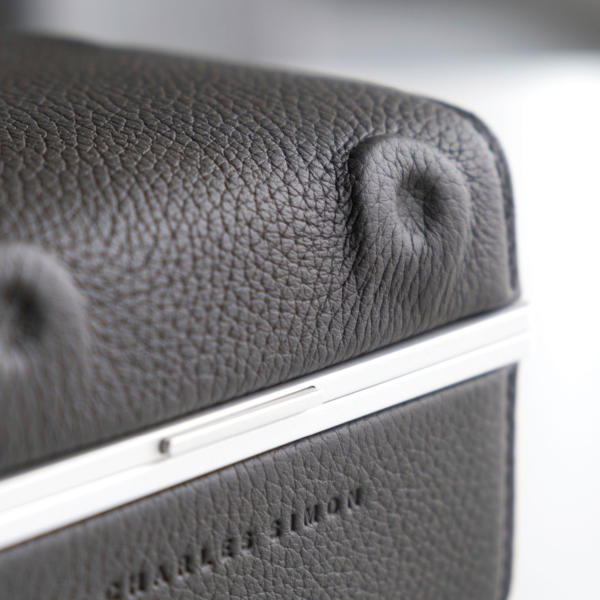Detail photo of the nostril of the Hippo watch case by Charles Simon. Handmade in Canada from premium leather and anodized aluminum.