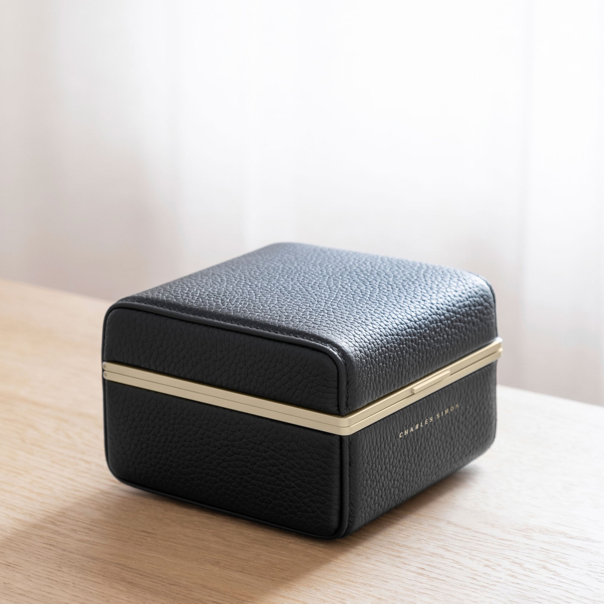 Lifestyle photo of closed Eaton 1 gold watch case for 1 watch. Made to transport, hold and display your favorite watch.
