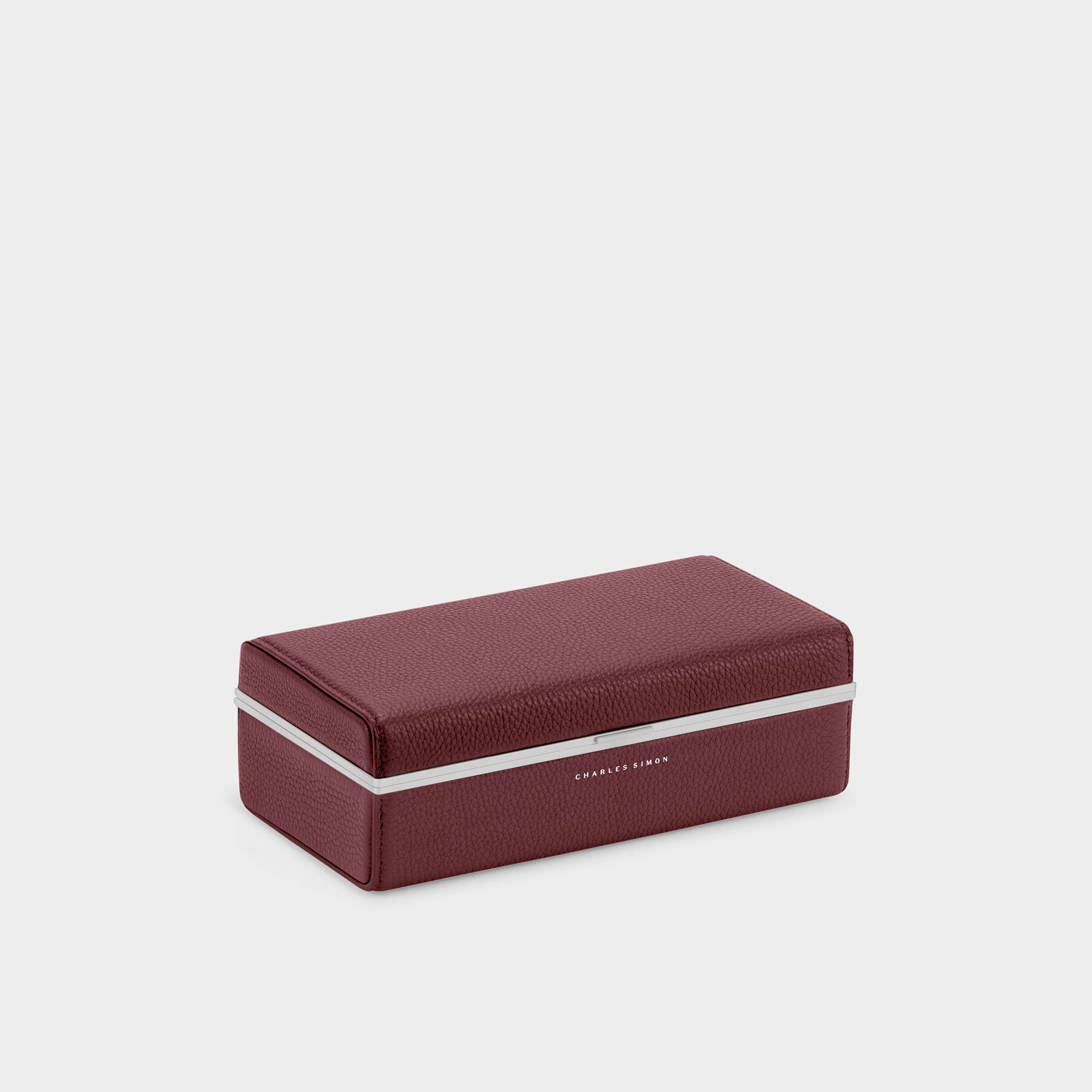 Charles Simon Eaton 3 watch  case in burgundy angled closed view showcasing sleek anodized aluminum frame clasp