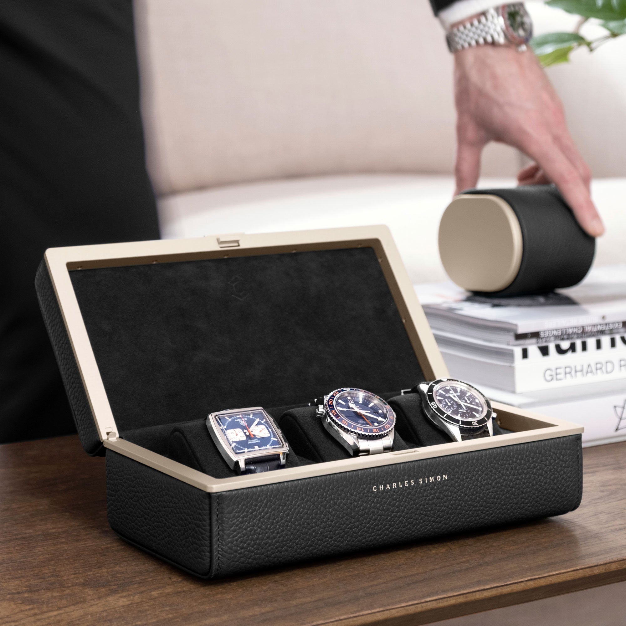 Lifestyle photo of open Eaton 3 Watch case in gold and black leather. Handmade in Canada for watch lovers worldwide.