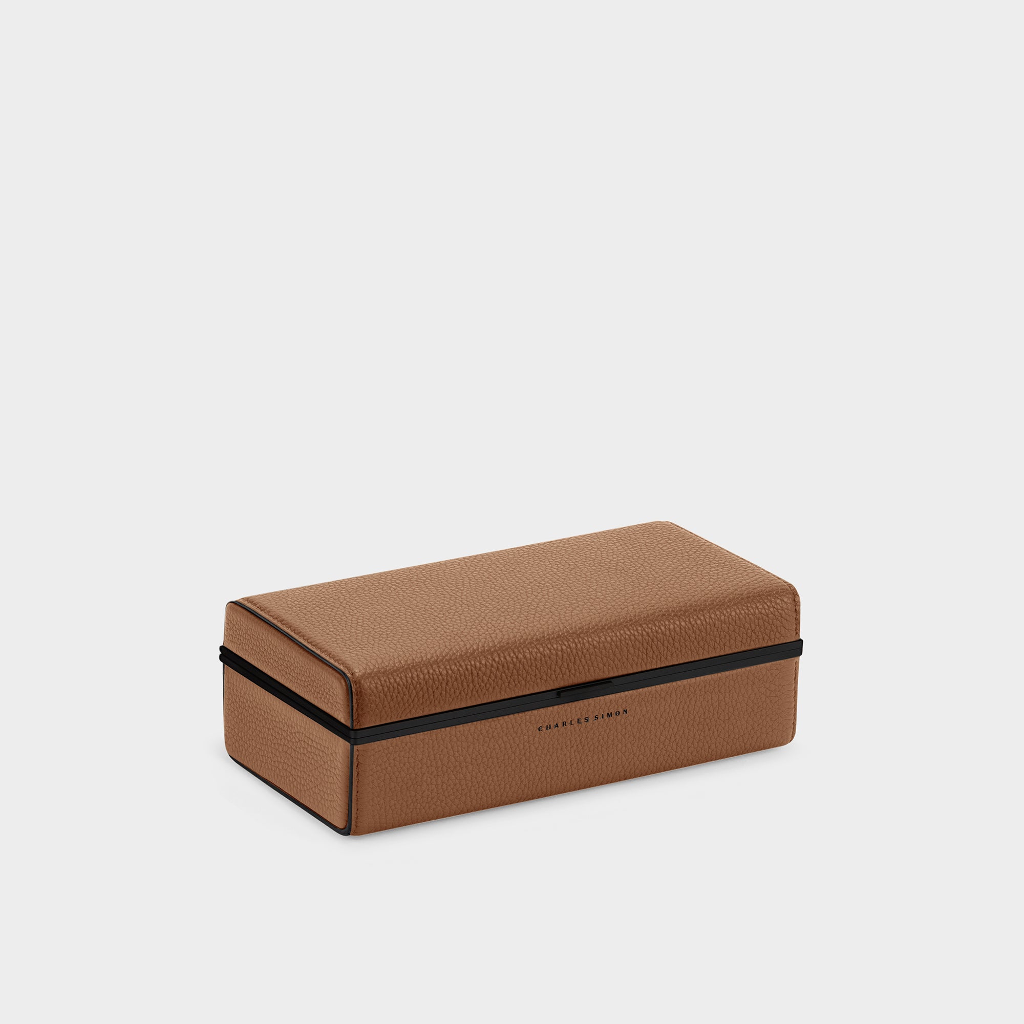 Closed Eaton 3 watch case in tan with black edges. Handmade to store, display and transport up to 3 watches.