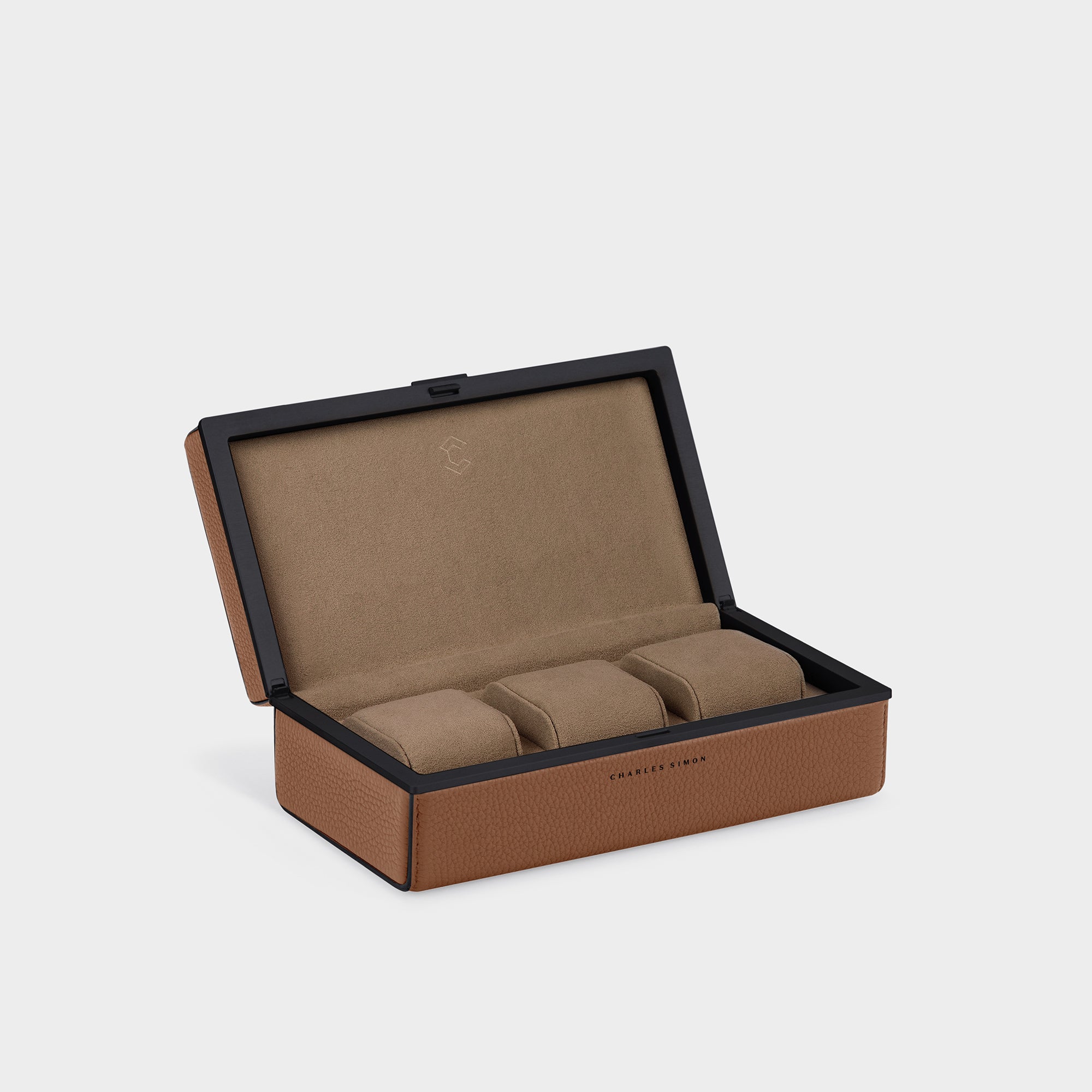 Luxury watch case for up to 3 watches. Handmade in Canada from premium tan French leather with black contrasting edges, Camel Alcantara and black anodized aluminum.