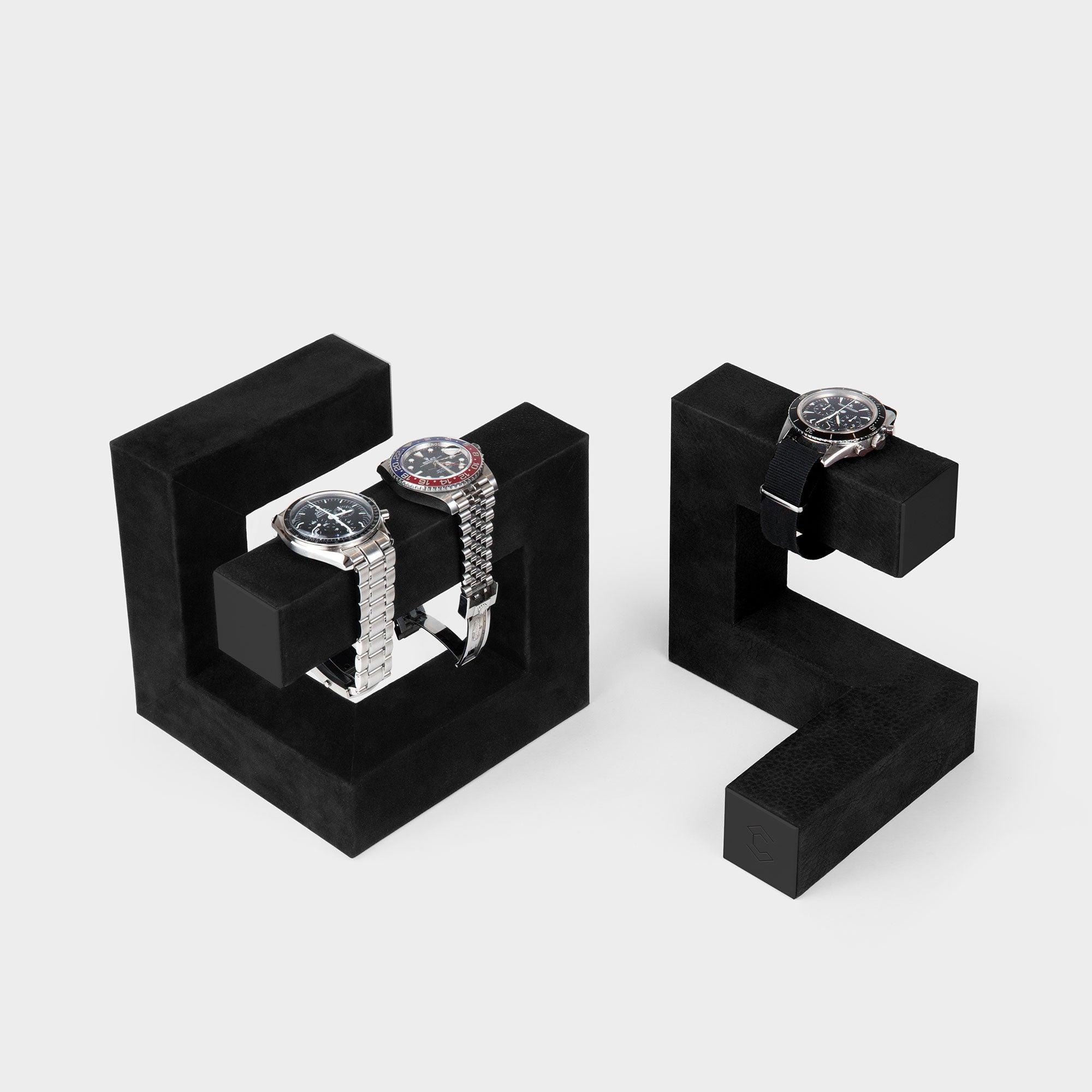 Product photo of all black Hudson Duo Watch stands holding three watches