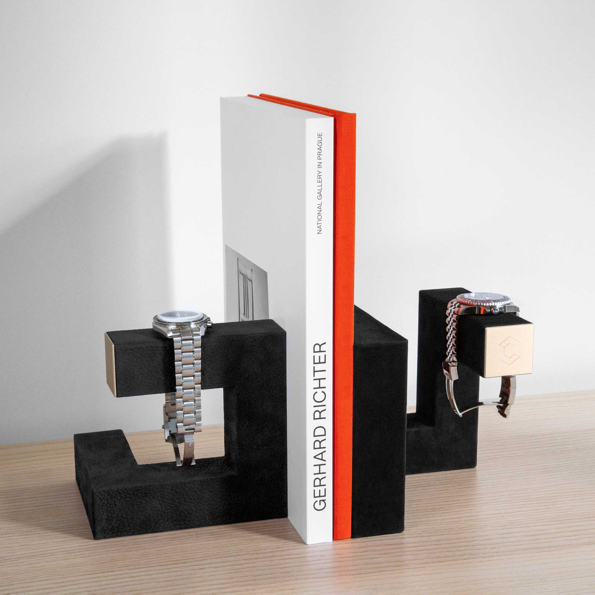 Hudson Duo gold watch stands displaying watches and serving as book ends at home