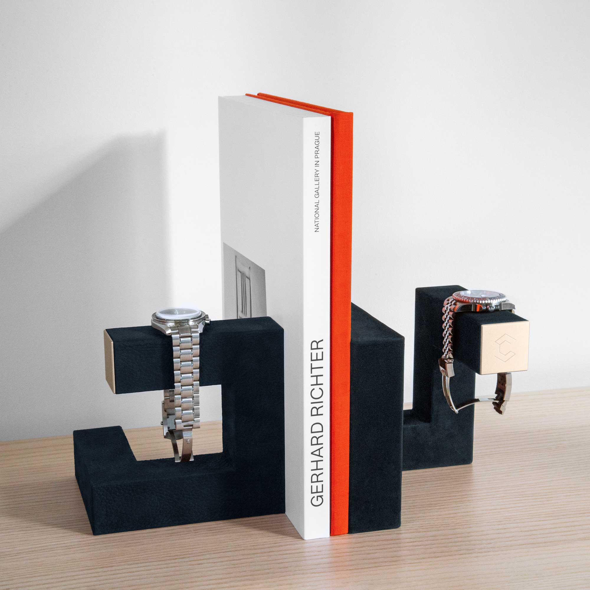 Hudson Duo Luxury watch stands in navy and gold functioning as book ends and displaying watches at home
