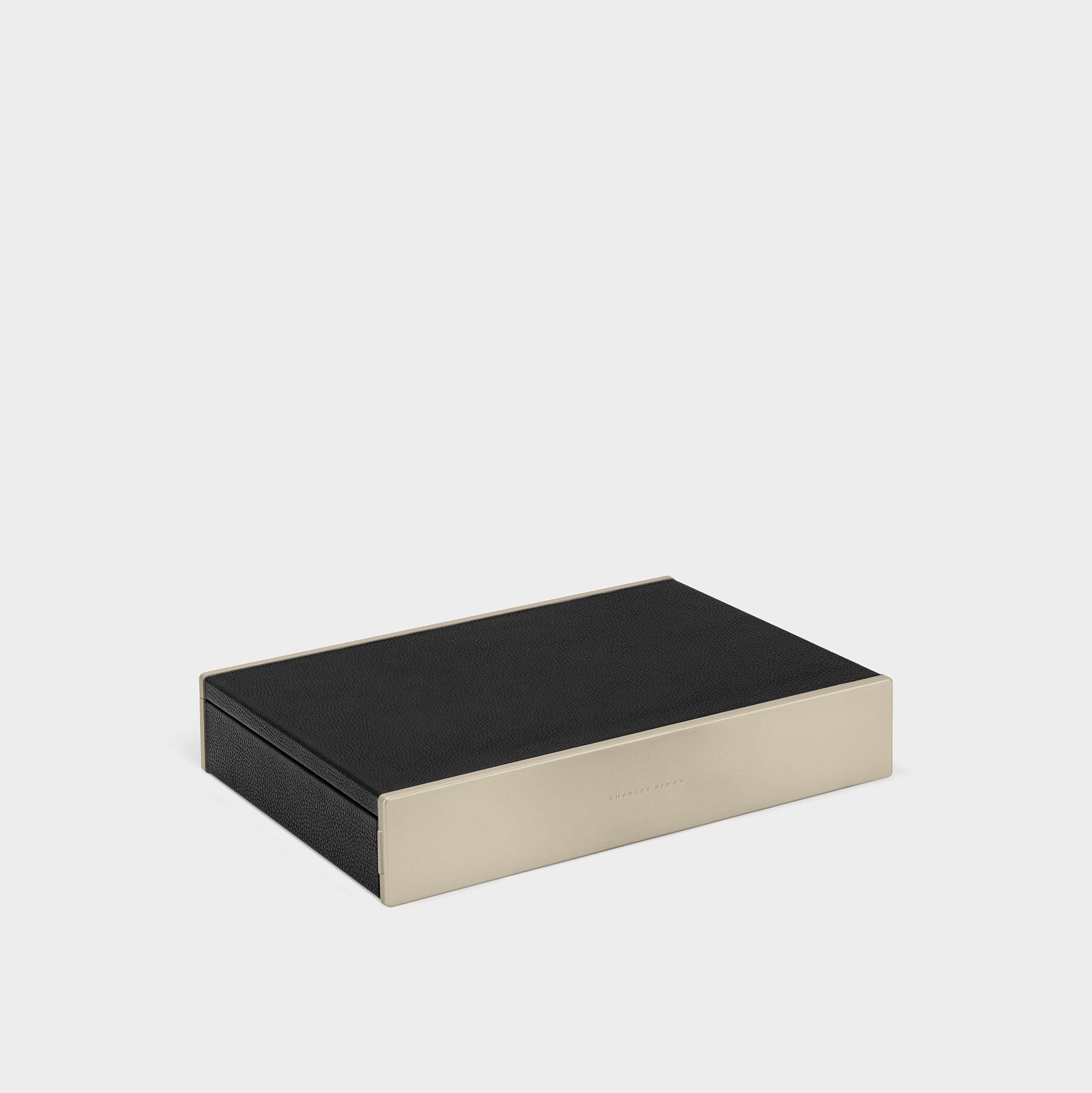 Product photo of closed Spence 12 Watch box in gold and black leather to store and showcase your watches at home.