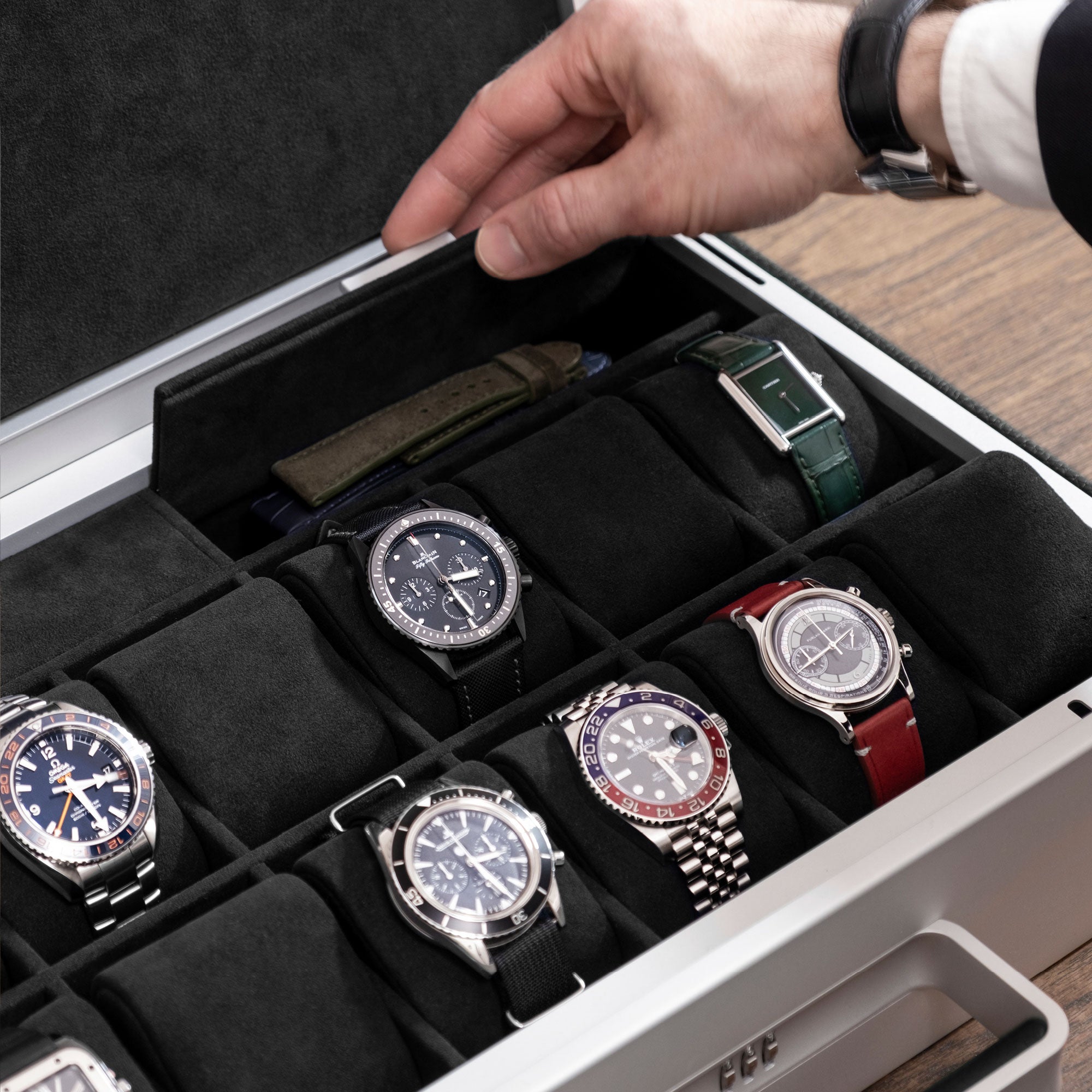 Detail shot of compartment in Mackenzie Watch briefcase 12 in black leather and Notte Alcantara made to hold watch straps. gloves and other watch accessories