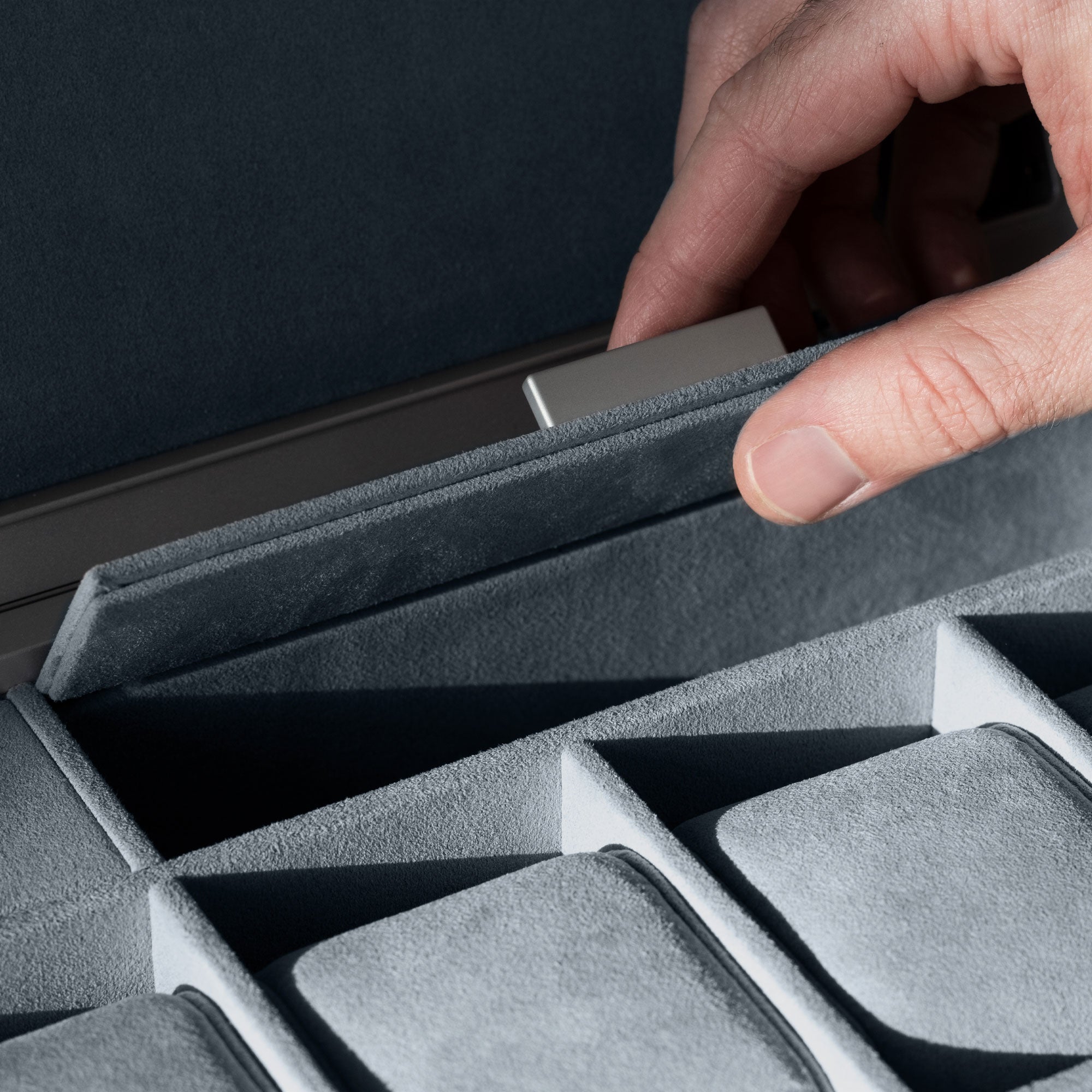Detail shot of compartment in Mackenzie Watch briefcase 12 in smoky blue Alcantara made to hold watch straps, gloves and other watch accessories