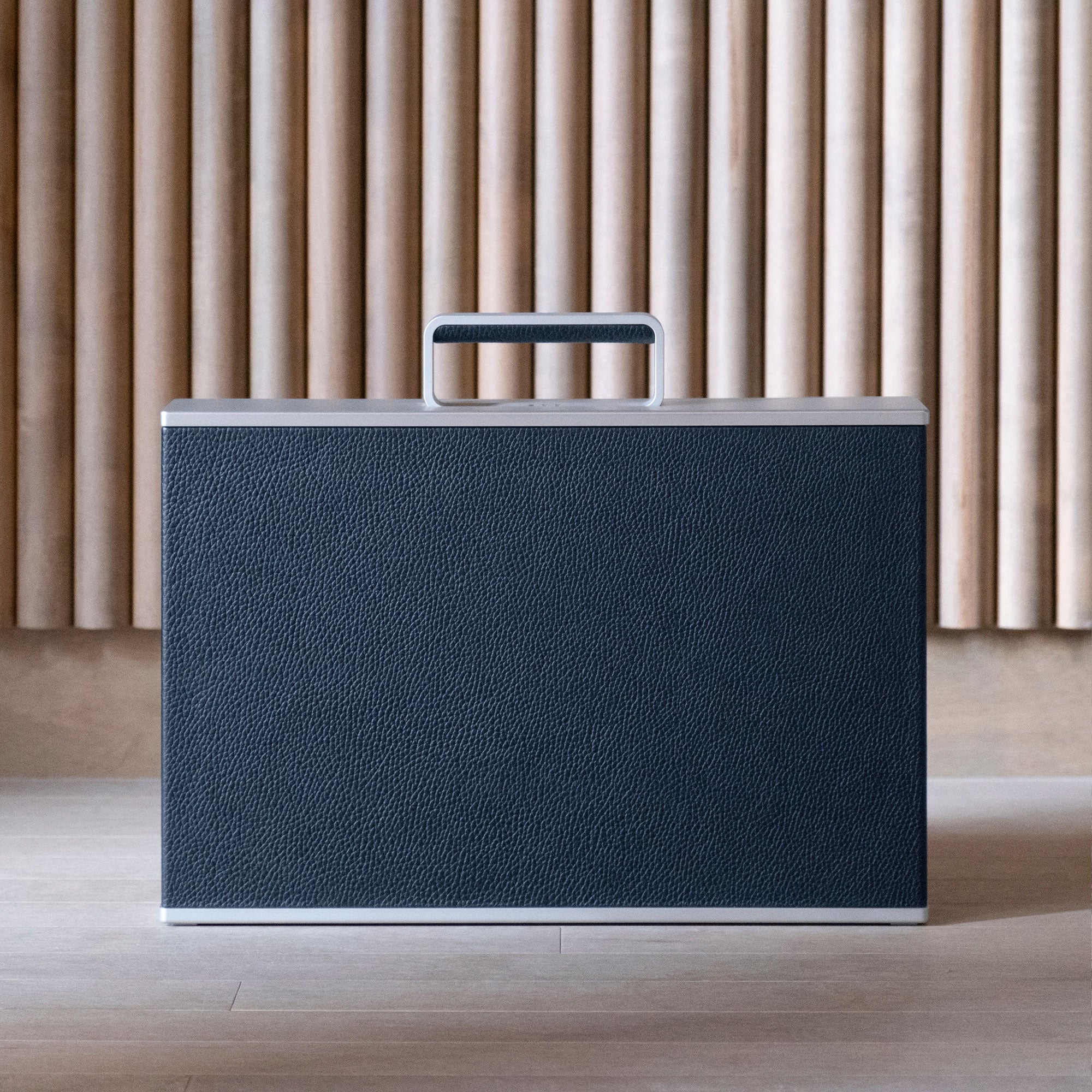 Lifestyle shot of Charles Simon Watch briefcase in marine leather and grey anodized aluminum made by hand in Canada
