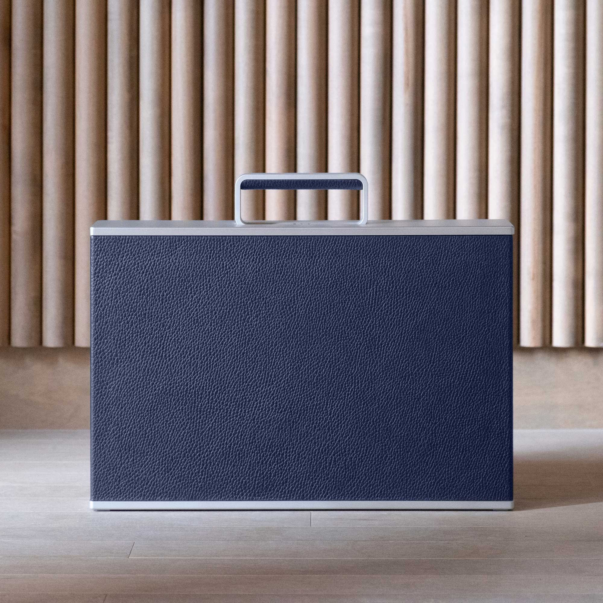 Lifestyle shot of Charles Simon Watch briefcase in sapphire leather and grey anodized aluminum made by hand in Canada