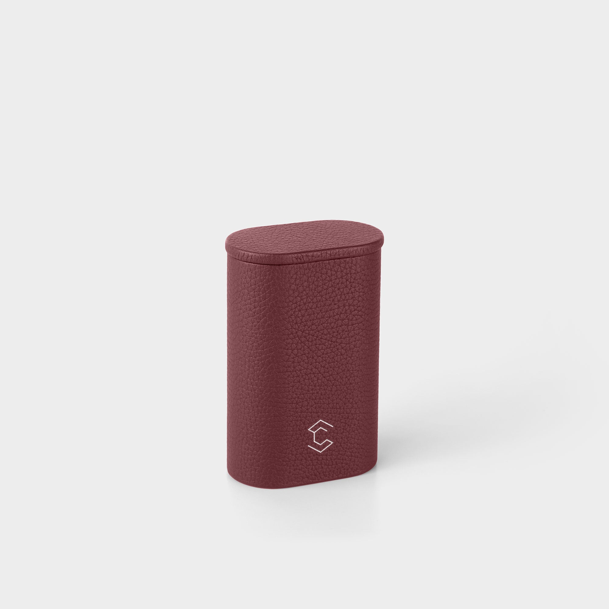 Burgundy leather watch roll with a Charles Simon monogram hot stamping