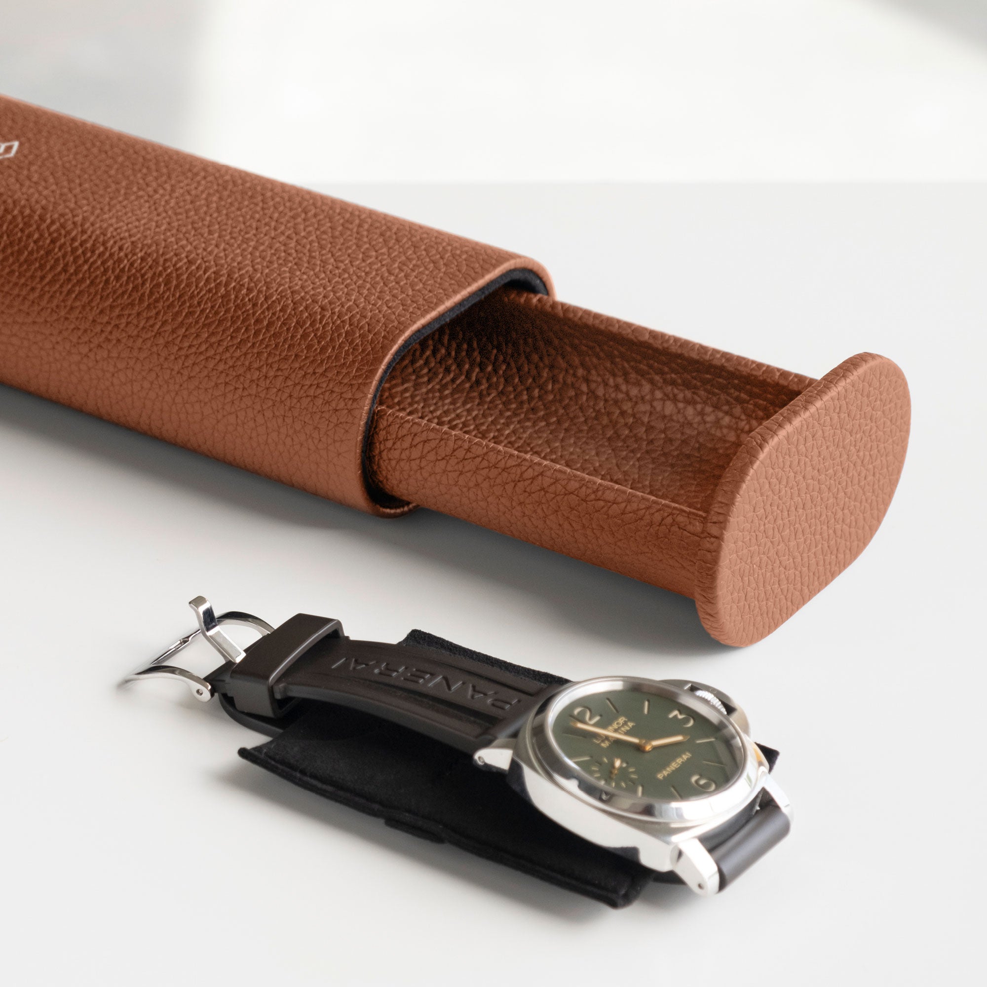 Open Oscar 1 Tall Travel Watch roll in tan leather with Panerai watch placed on the removable Alcantara card insert in front of the watch roll