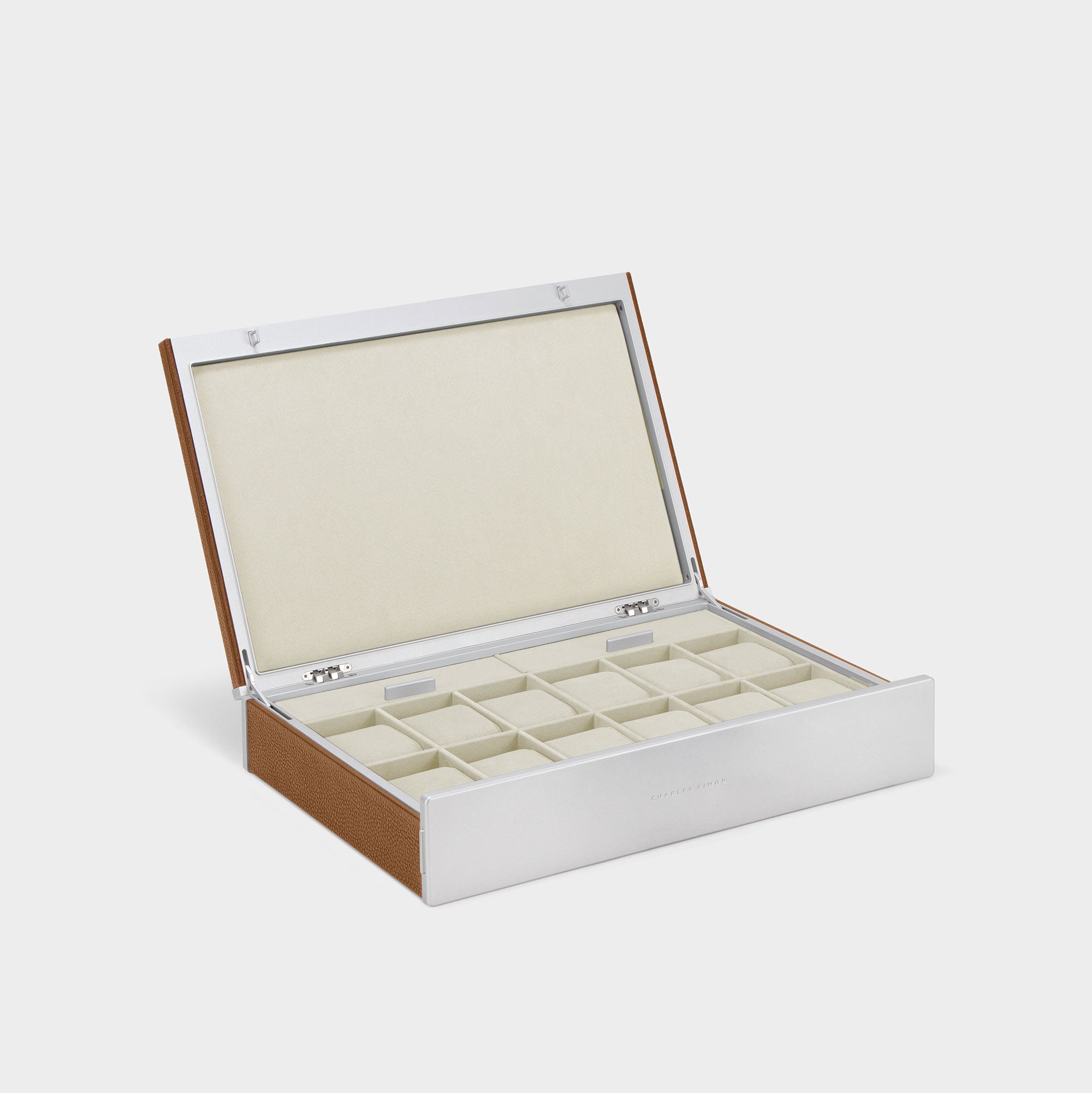 Product photo of open handmade watch box for 12 watches in tan leather, carbon fiber and anodized aluminum casing and eggshell Alcantara interior