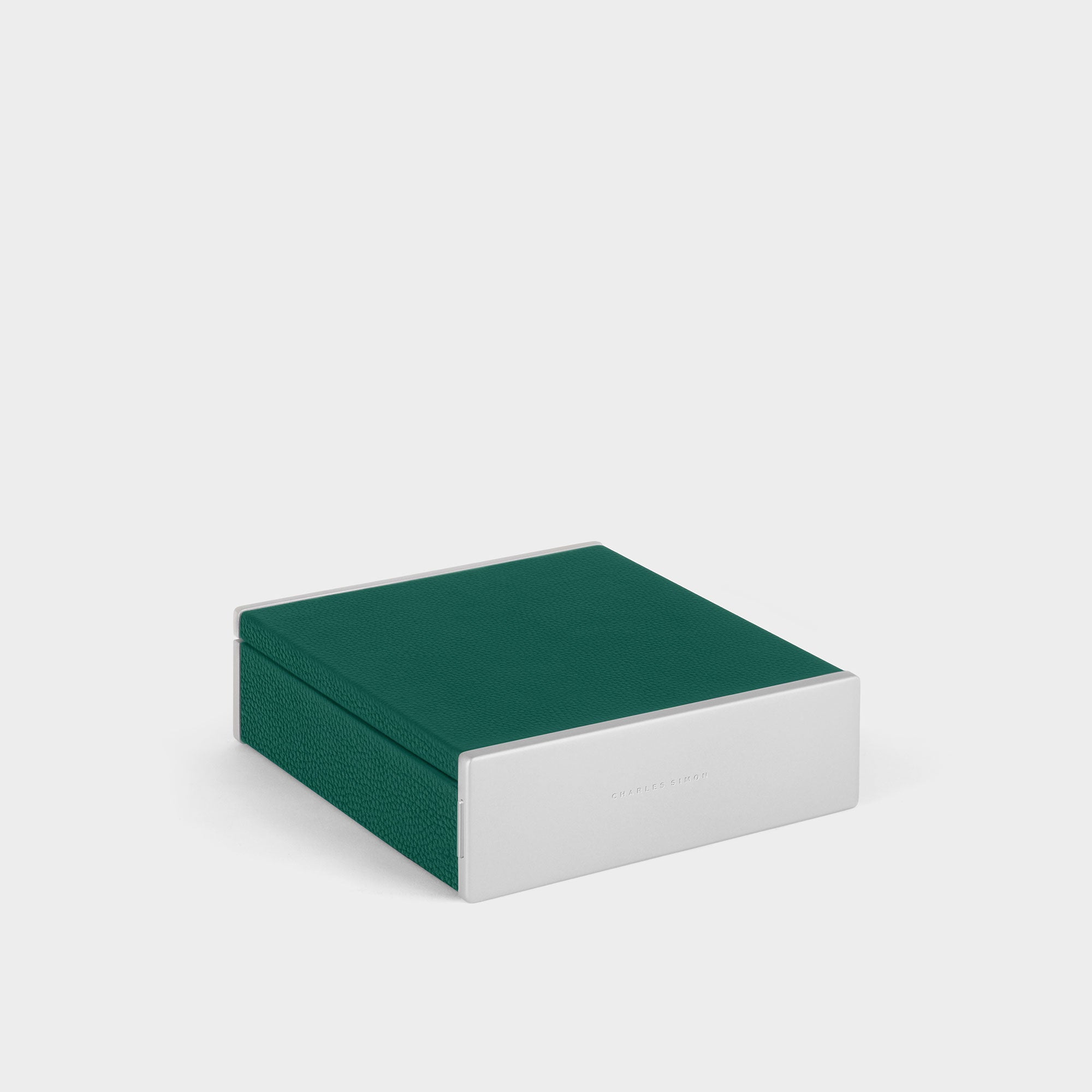 Closed designer watch box by Charles Simon. Handcrafted in Canada from emerald leather and deep blue interior.