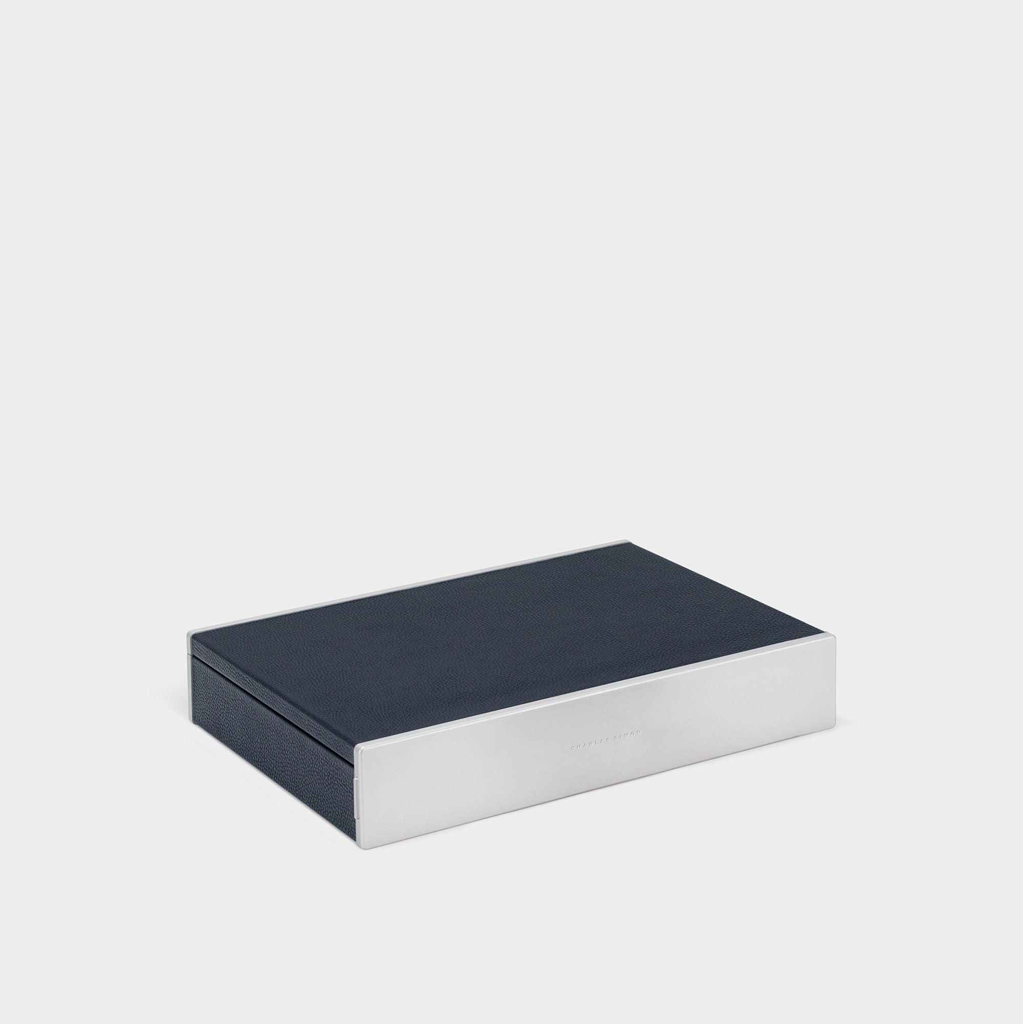 Product photo of closed Taylor 4 Watch and Jewelry box in marine leather and carbon fiber and anodized aluminum casing.