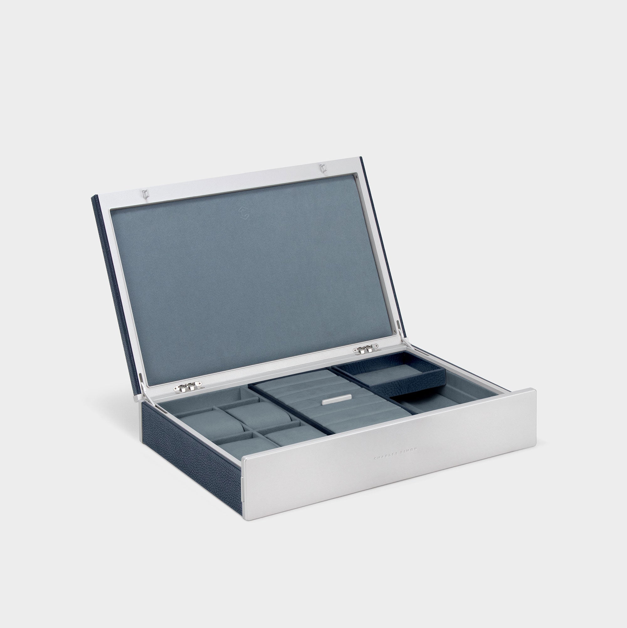 Product photo of open Taylor 4 Watch and Jewelry box in marine leather and smoky blue interior. Handmade watch and jewelry storage featuring room for 4 watches and removable compartments and trays for necklaces, bracelets, rings and earrings.