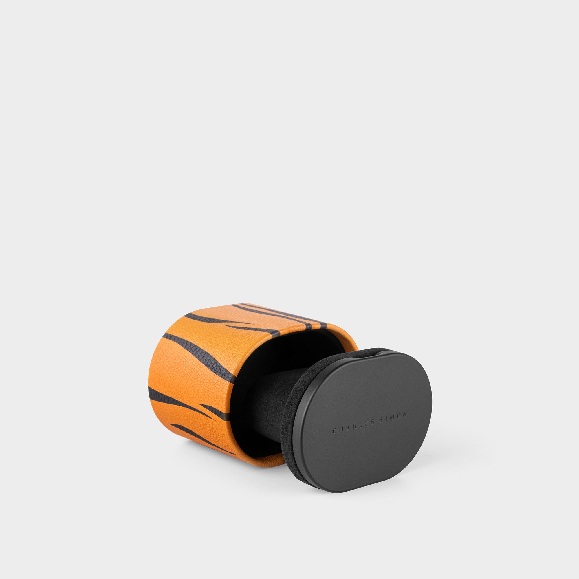 Product photo of Special Edition Tiger Theo Watch roll featuring tiger pattern made through leather marquetry.