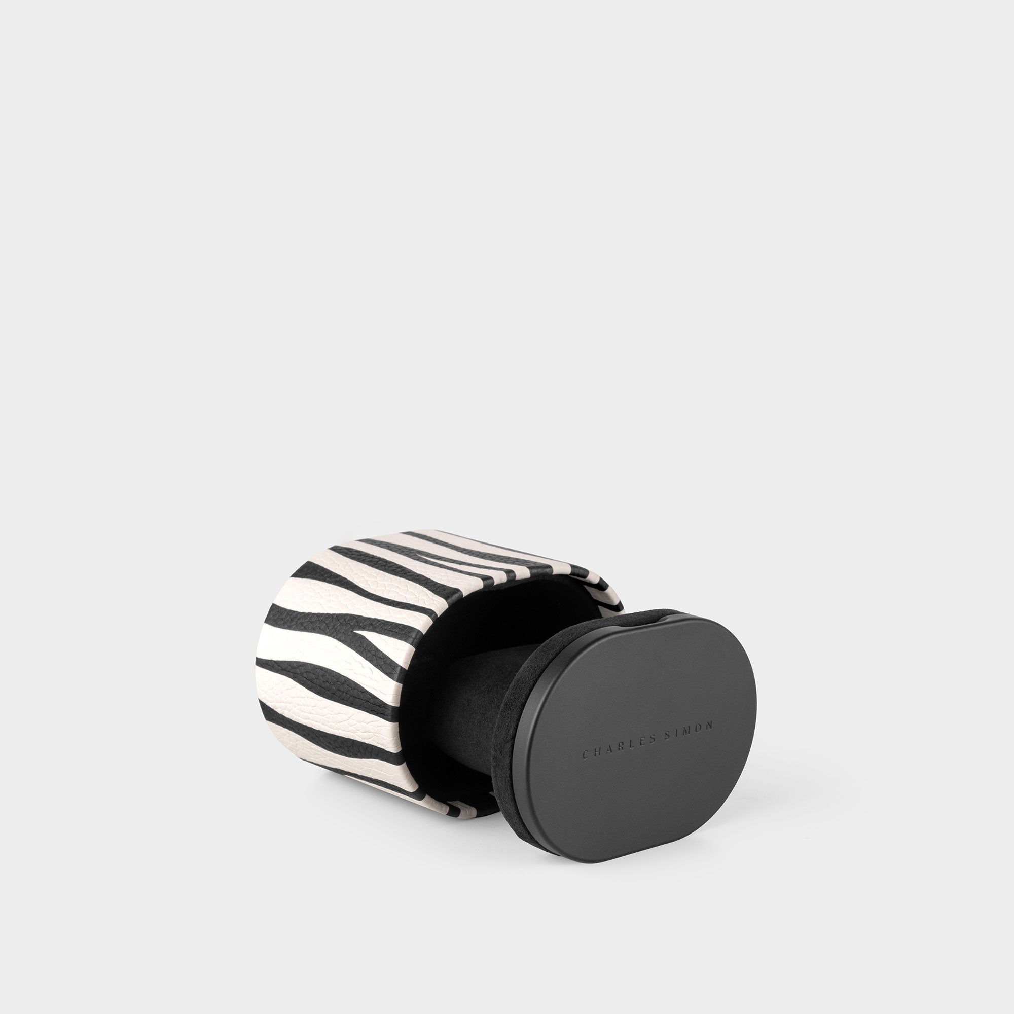 Product photo of Special Edition Zebra Theo Watch roll featuring zebra pattern made through leather marquetry.