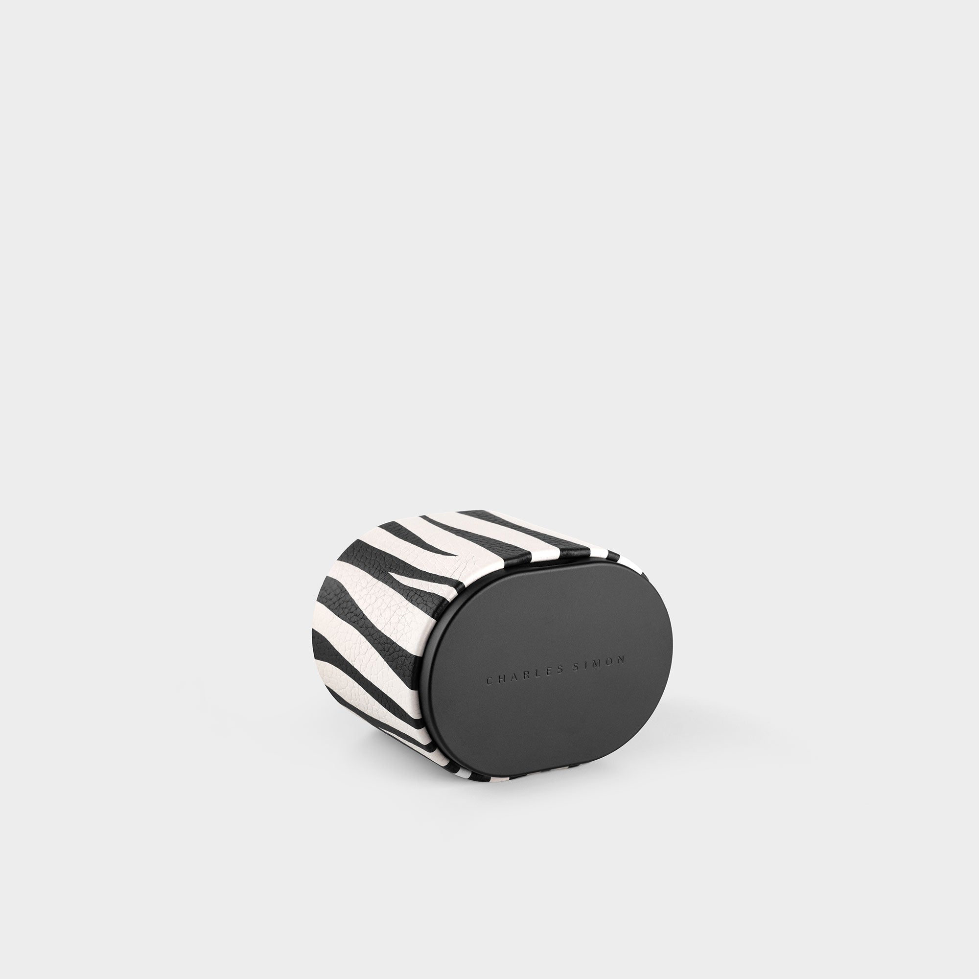 Product photo of closed special edition zebra watch roll made from anodized aluminum, French bull leather and soft Alcantara interior.
