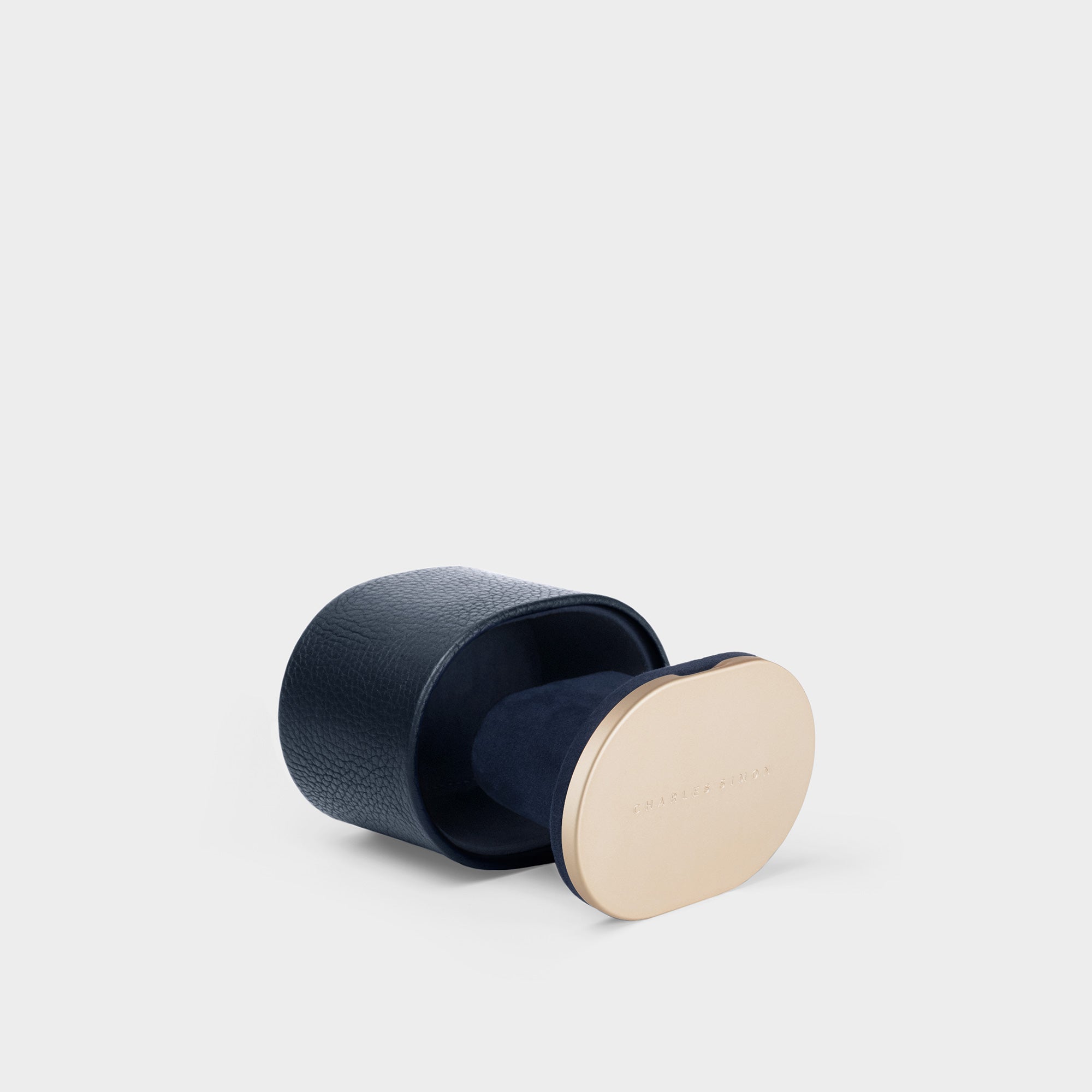 Product photo showing open gold collection Theo watch roll in marine leather, deep blue interior and gold-colored champagne aluminum. Handmade in Canada.