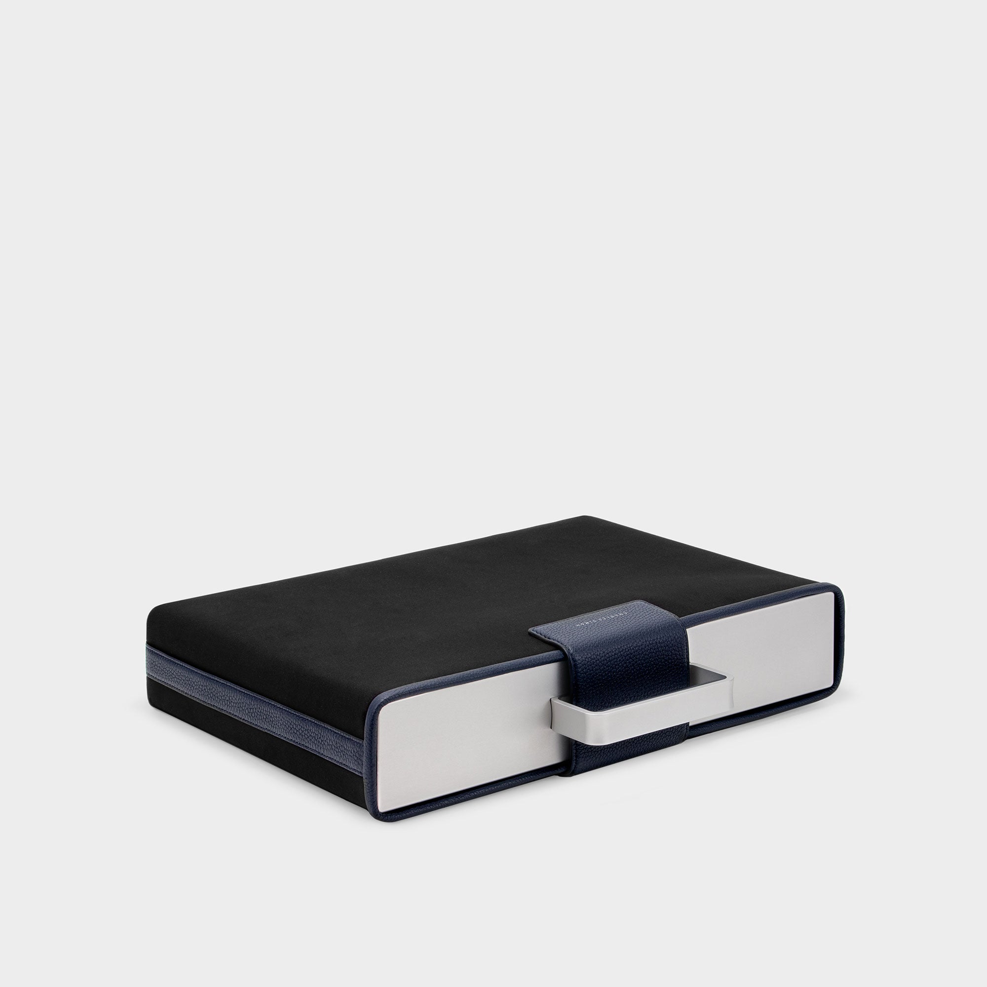 Protective cover for the Mackenzie in neoprene and marine leather details. Handcrafted by Charles Simon.