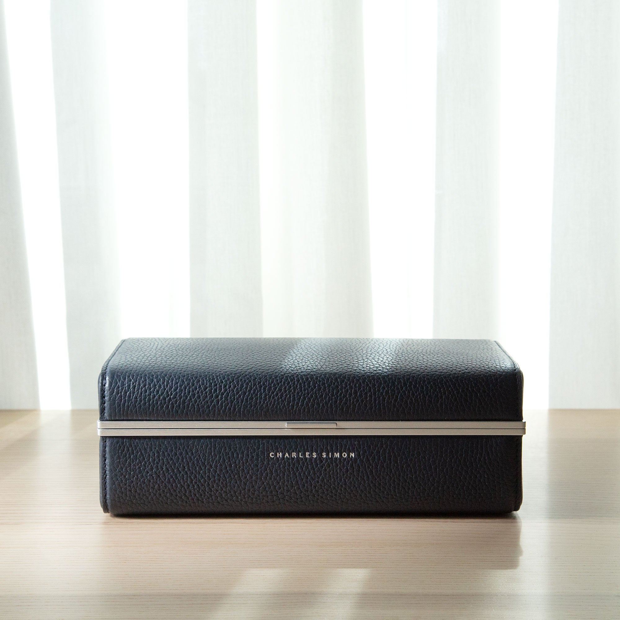 Lifestyle shot of Eaton 3 leather watch case for travel in marine