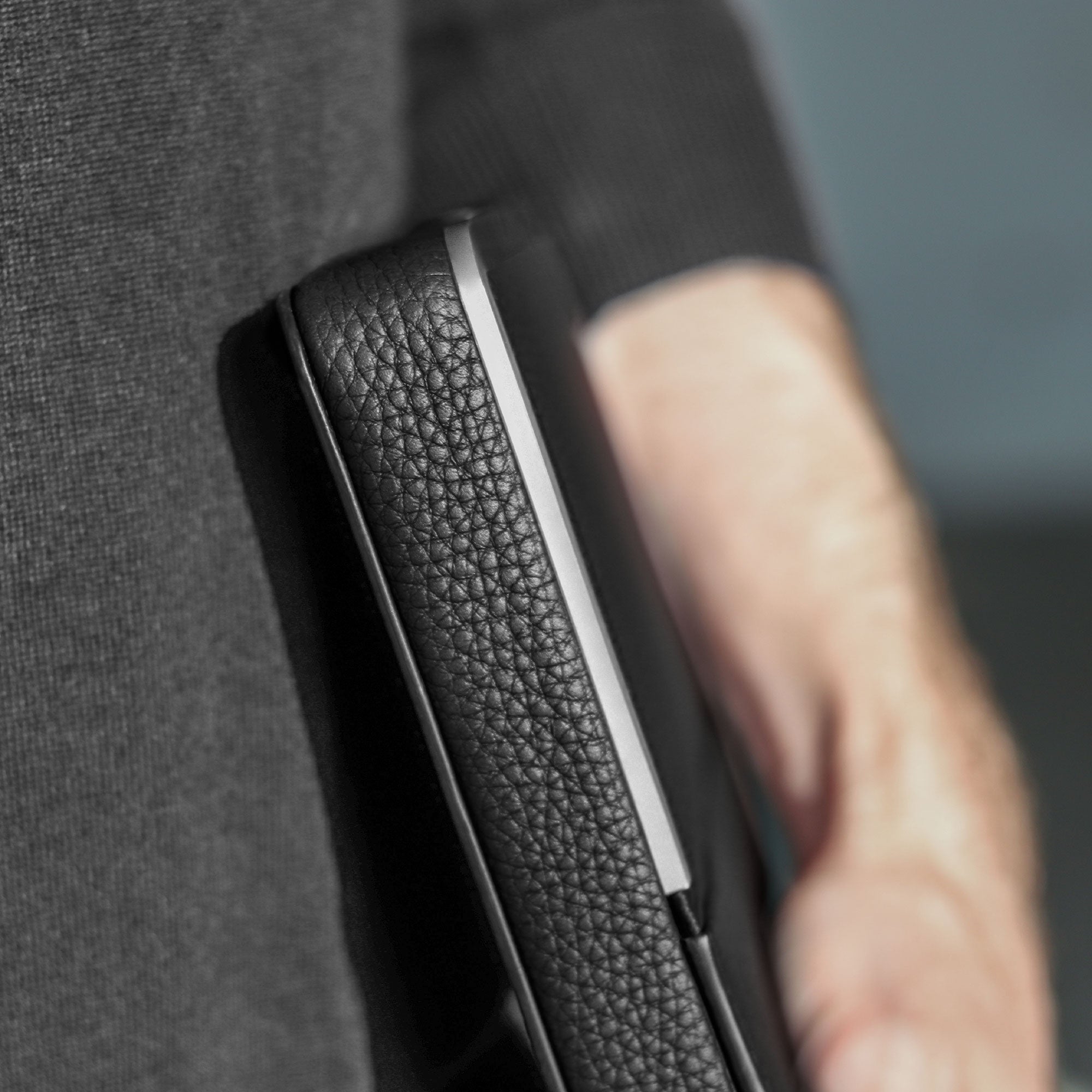 Fraser travel wallet by Charles Simon, man holding luxury travel wallet, details of luxury travel wallet