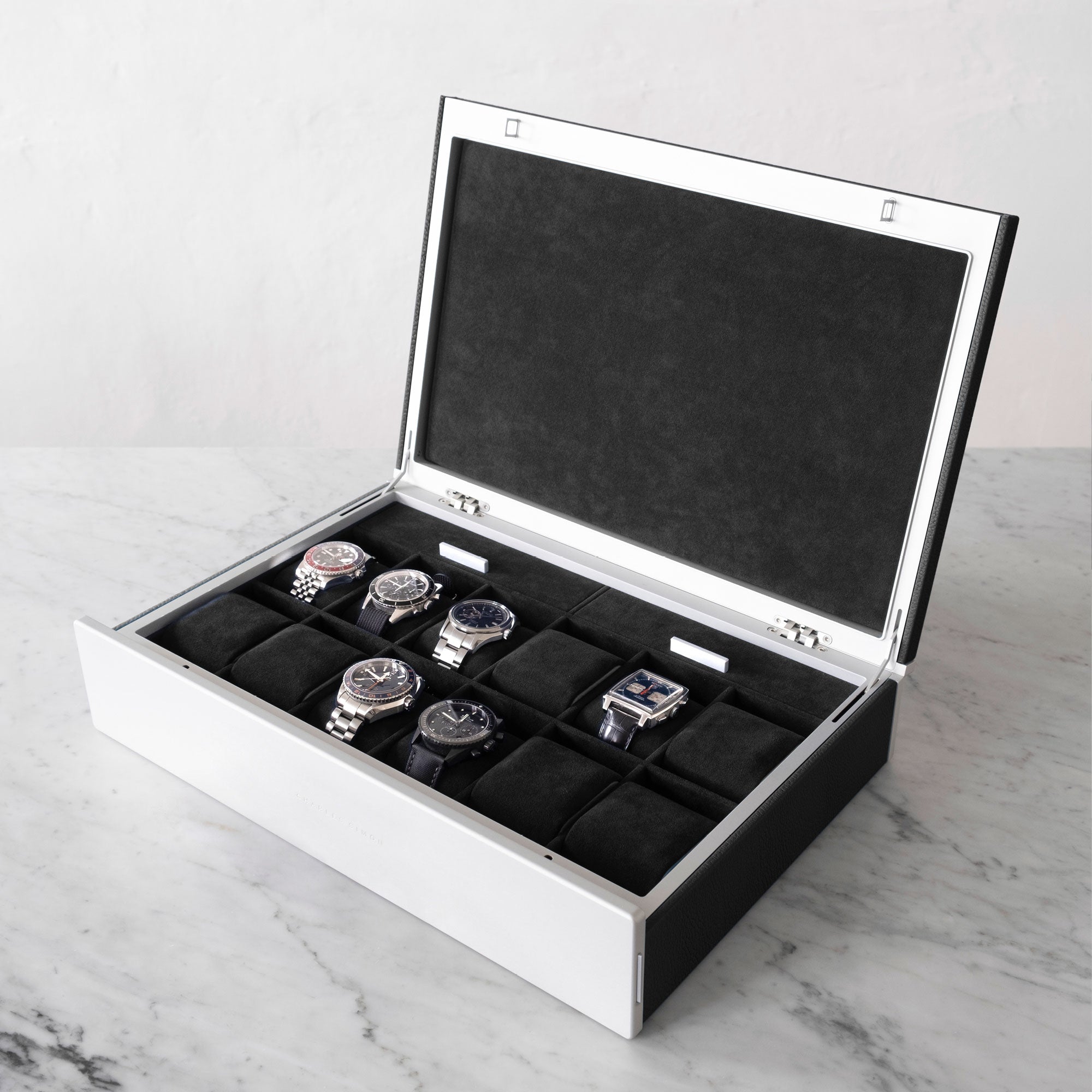 Lifestyle photo of Spence 12 Watch box for a watch collection of up to 12 watches in black leather and black Alcantara interior