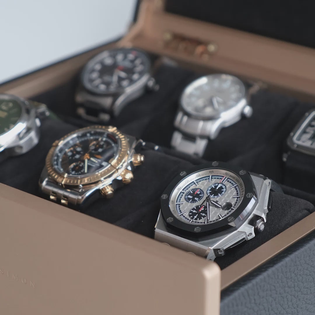 Closeup photo of luxury watches displayed in Charles Simon x Paris Watch Club watch box.