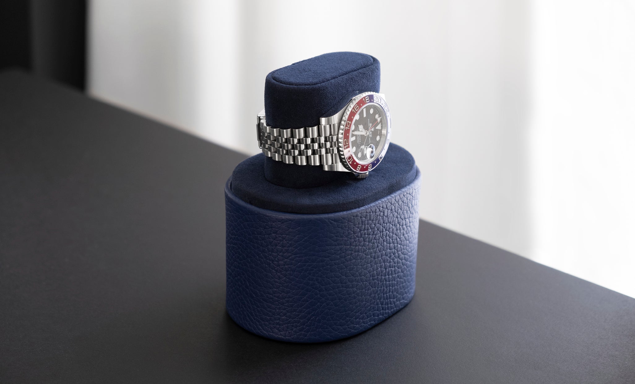 theo watch roll, luxury watch roll handmade in canada, photo of navy watch roll open with watch on top