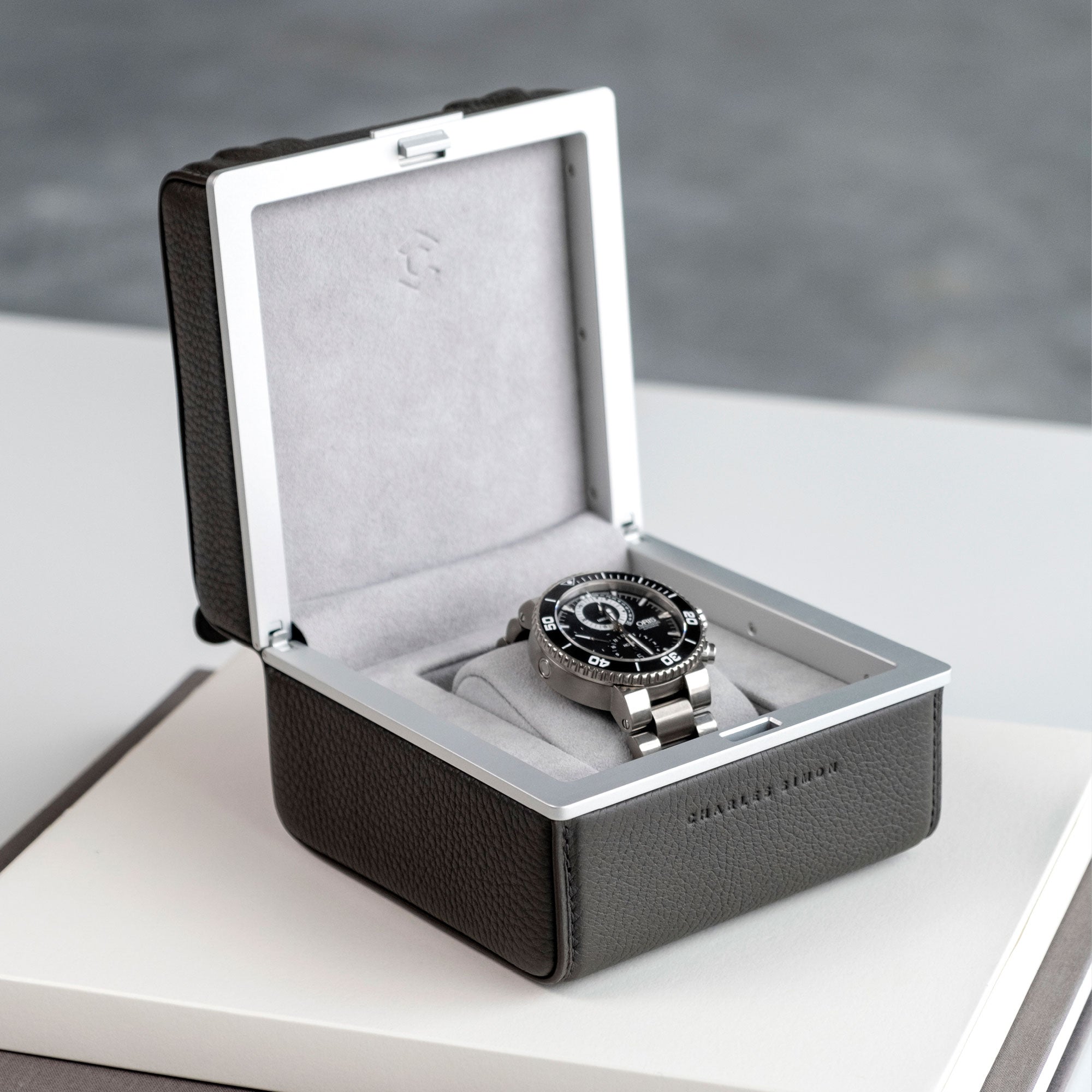 Lifestyle photo of Eaton 1 Hippo Watch case displaying Oris luxury men's watch