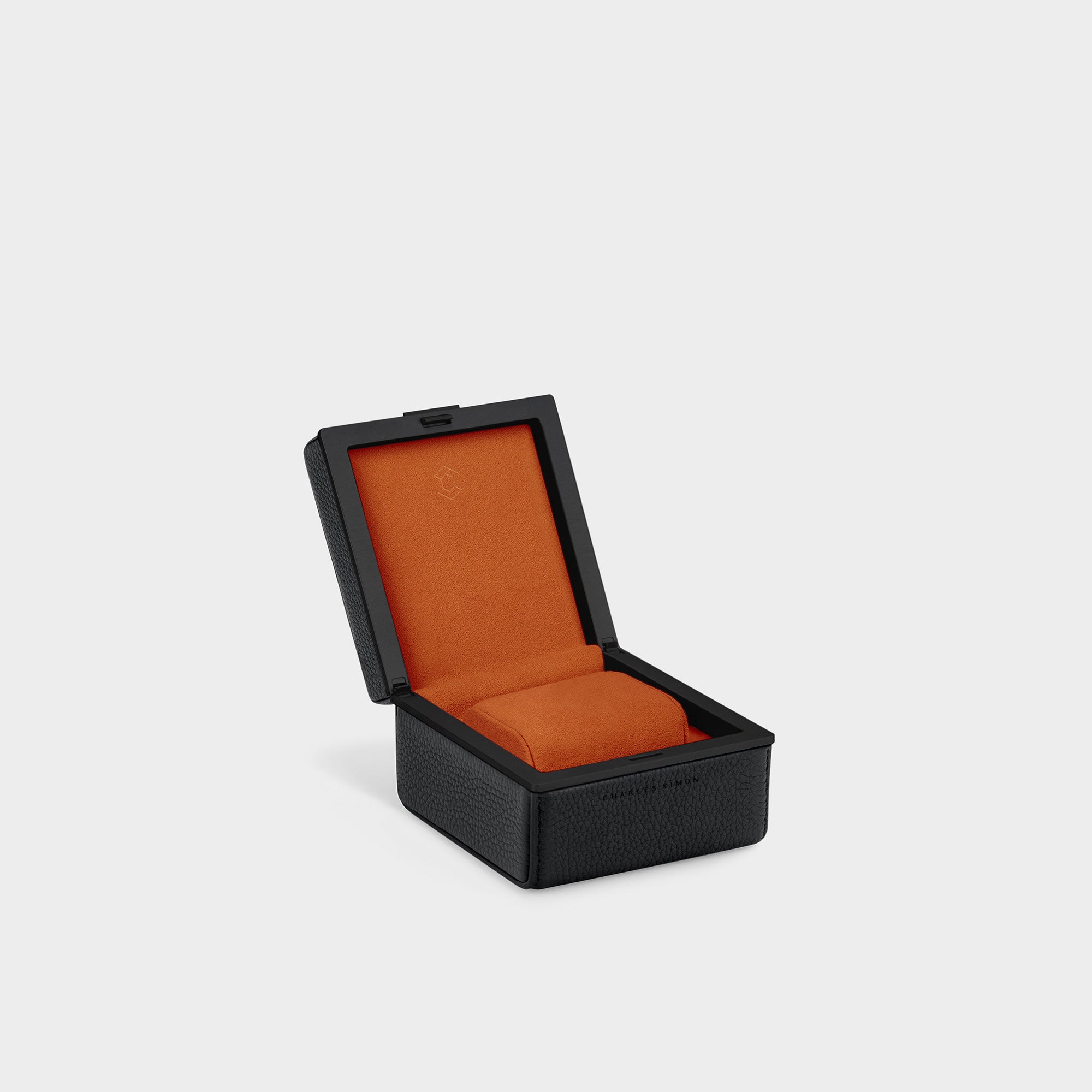 Product photo of Eaton 1 watch case for 1 watch in black leather and Papaya Alcantara interior