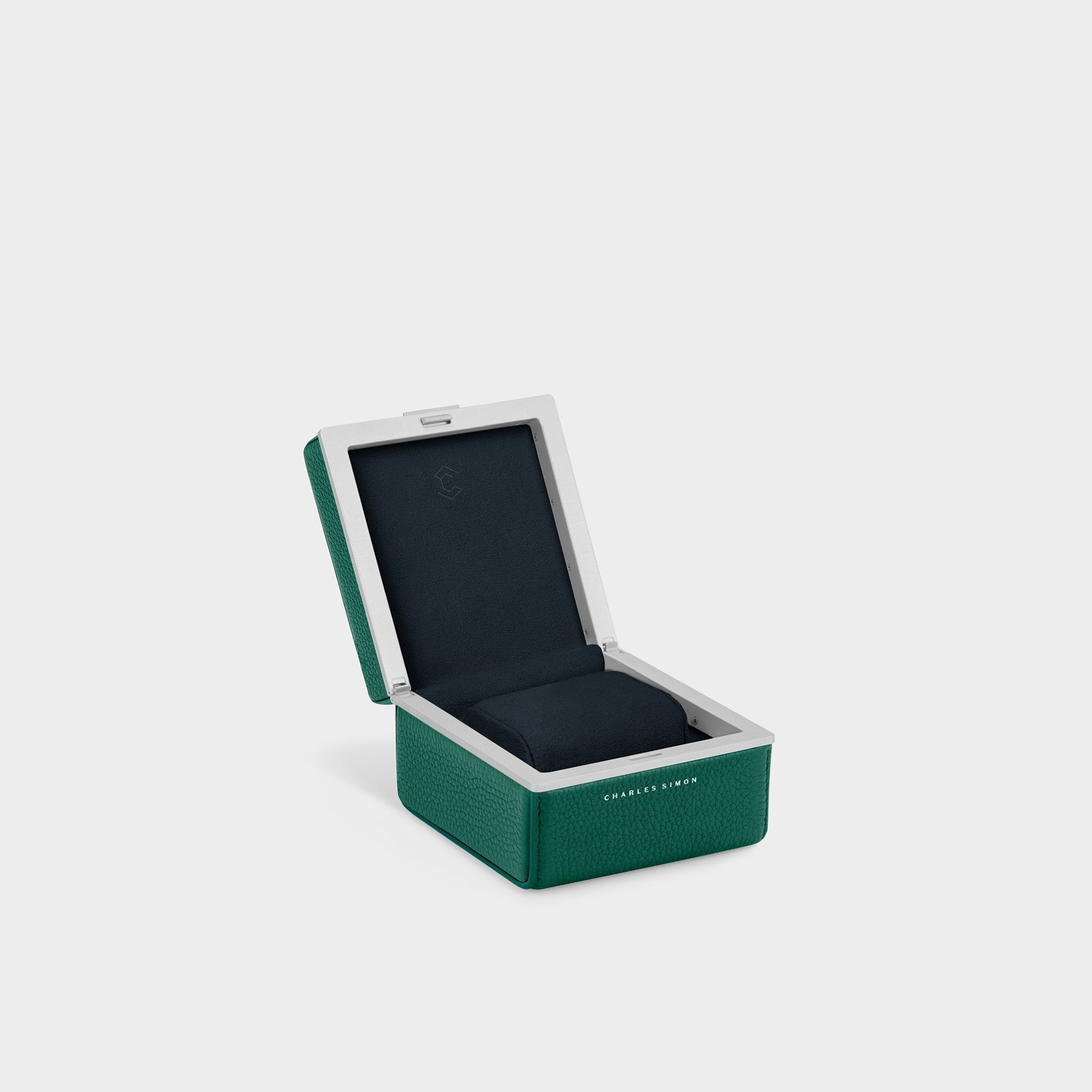 Eaton 1 watch case for 1 watch. Handmade from emerald French leather, anodized aluminum and deep blue Alcantara interior