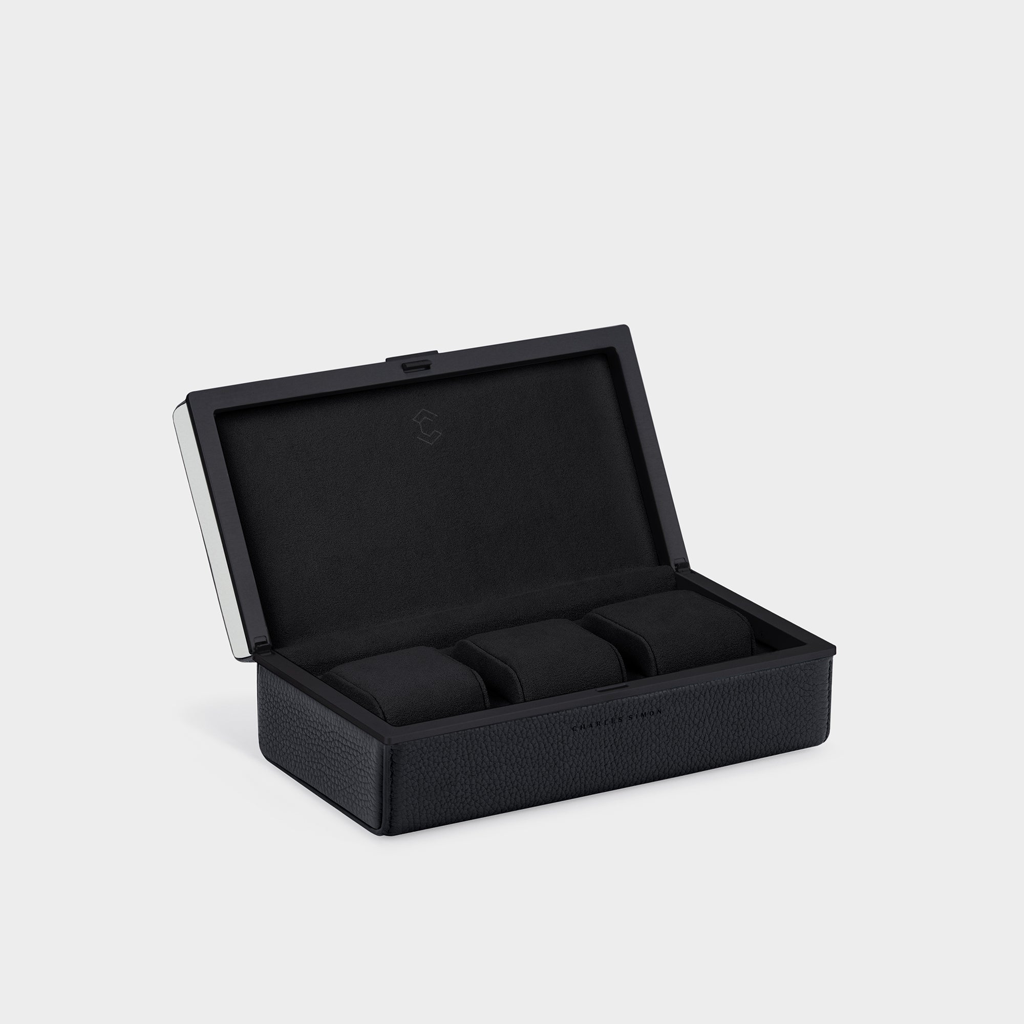 Product shot of Eaton 3 Watch case in all black with white top handmade to store up to 3 watches