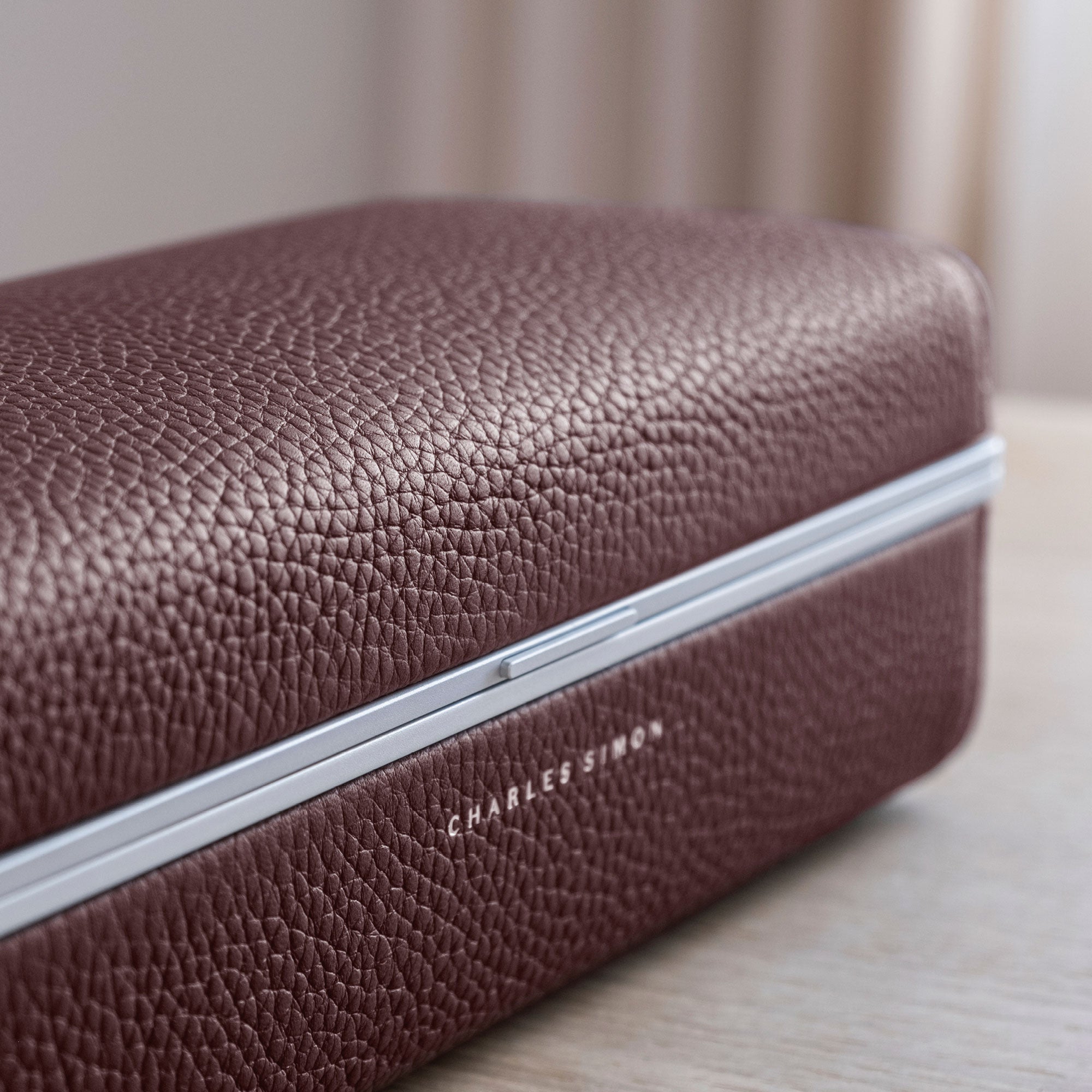 Detail photo of burgundy leather on the Eaton 3 Watch case by Charles Simon.
