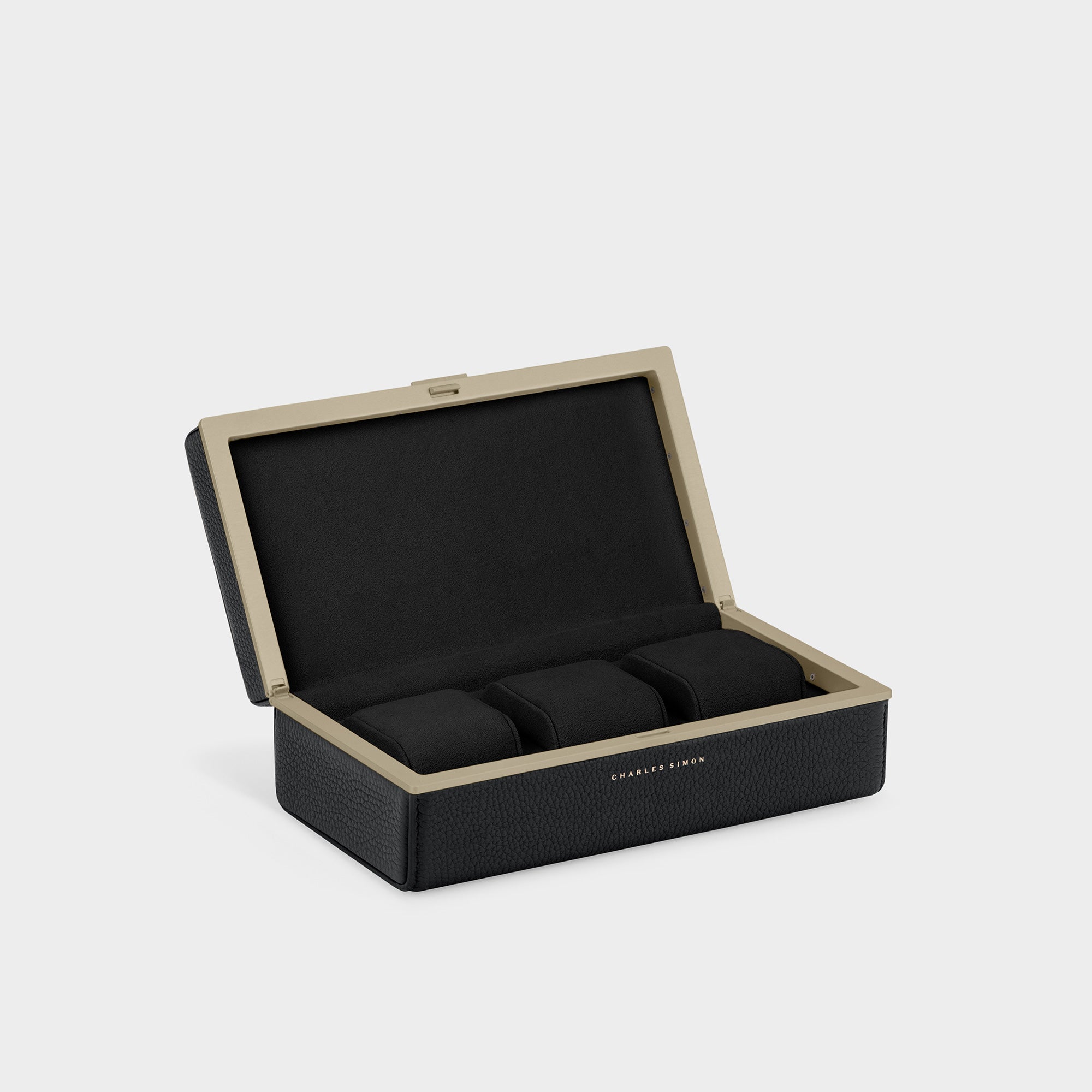 Eaton 3 Watch case in gold casing, black leather and black interior for up to 3 watches. 
