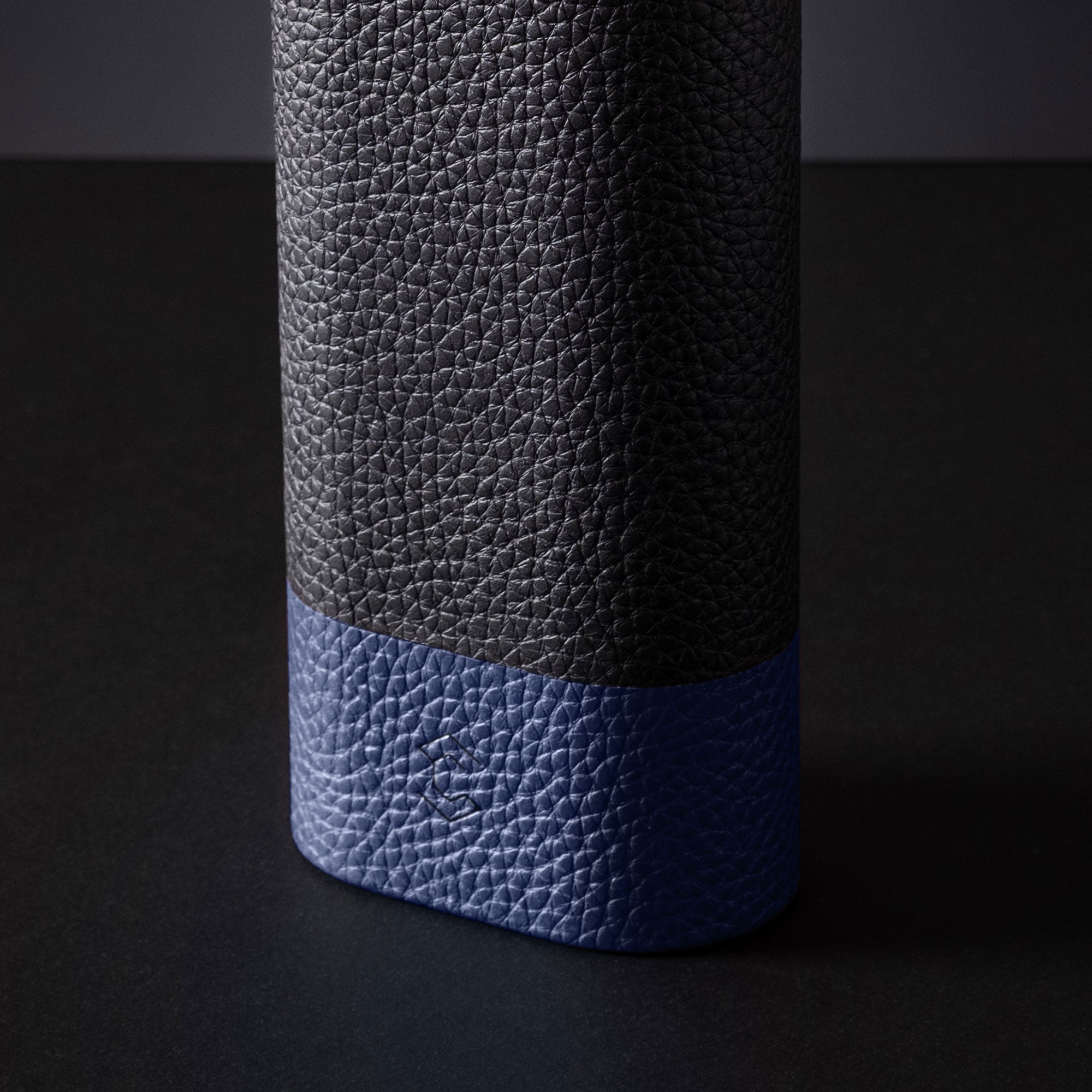 Travel watch roll leather watch case, compact design for secure storage of one watch with strap, in black and blue.