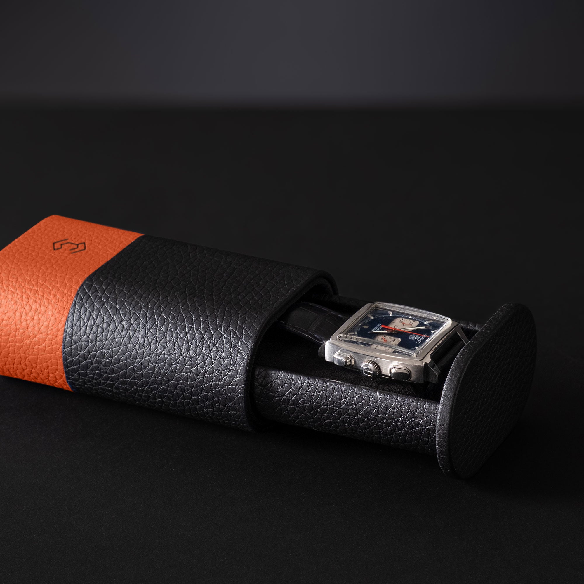 Leather watch roll black and orange, sleek and modern Formula 1 inspired, single watch case with strap for secure travel protection.