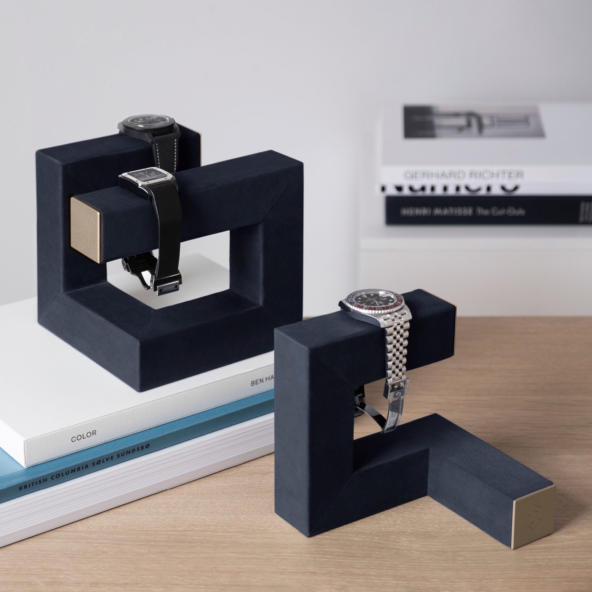 Hudson watch stands in navy leather and gold. Handmade to display your watches at home.