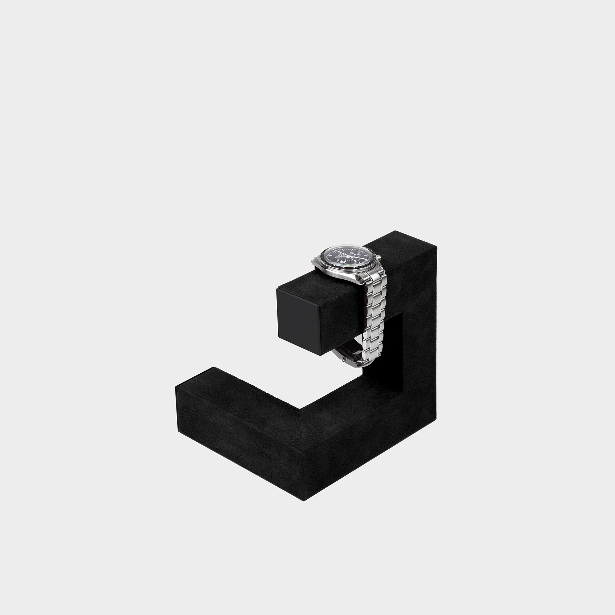 Product photo of all black Hudson 1 watch stand by Charles Simon holding 1 watch.