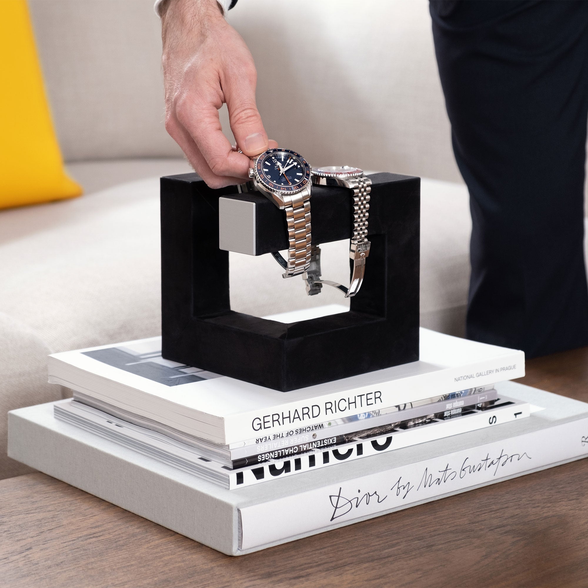 Watch collector taking his Omega from his Charles Simon Hudson 3 luxury watch stand