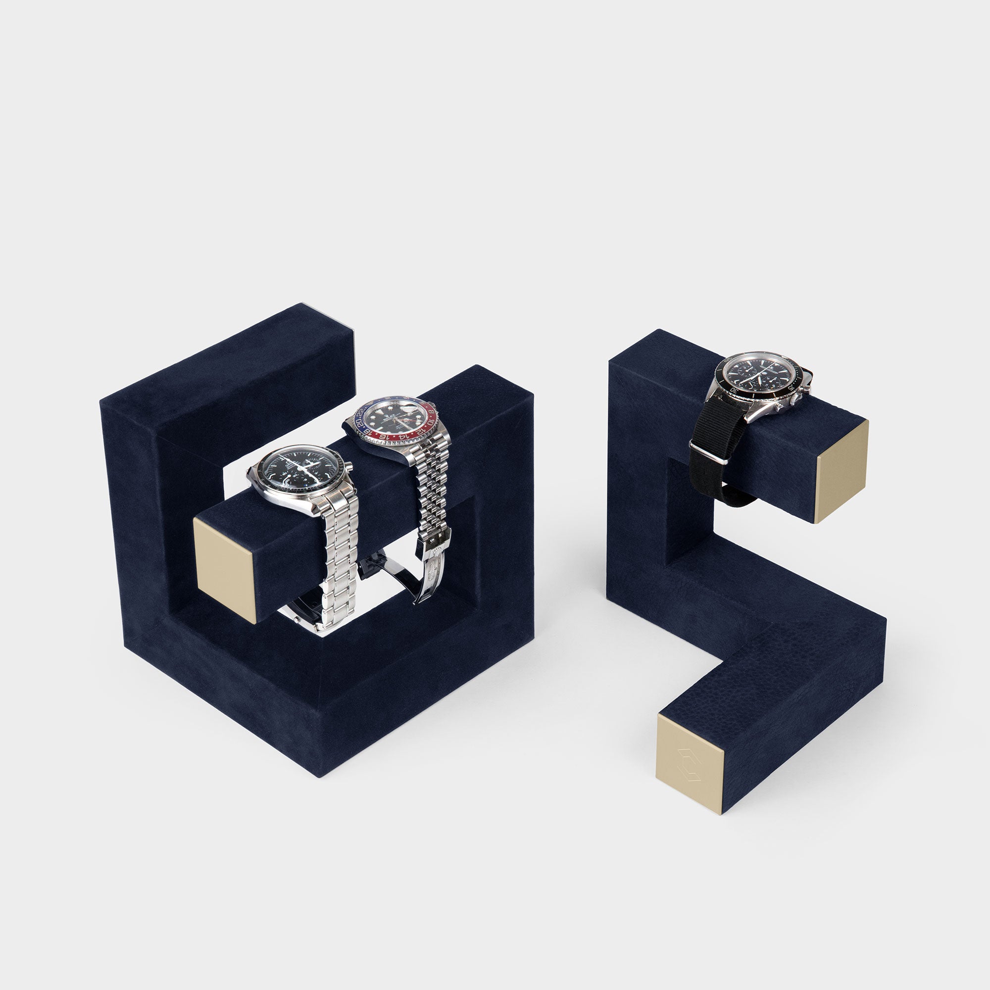 Product photo of Hudson Duo Watch stands in navy and gold displaying watches