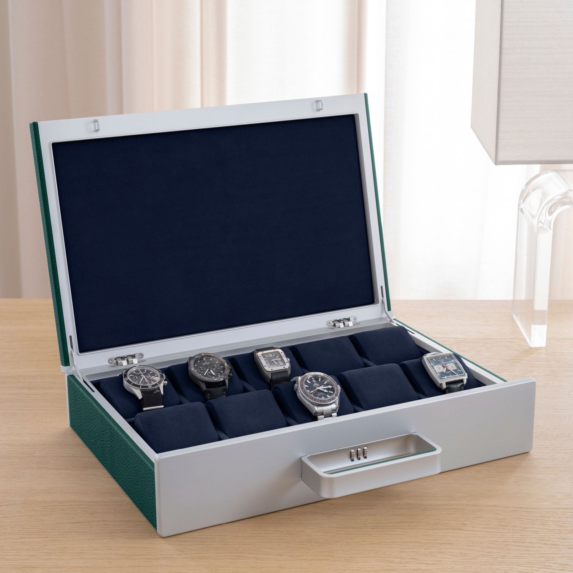 Designer Watch briefcase for 10 watches in emerald leather, carbon fiber and grey anodized aluminum and deep blue Alcantara interior with luxury watches including Blancpain, Tag Heuer and Jaeger-LeCoultre