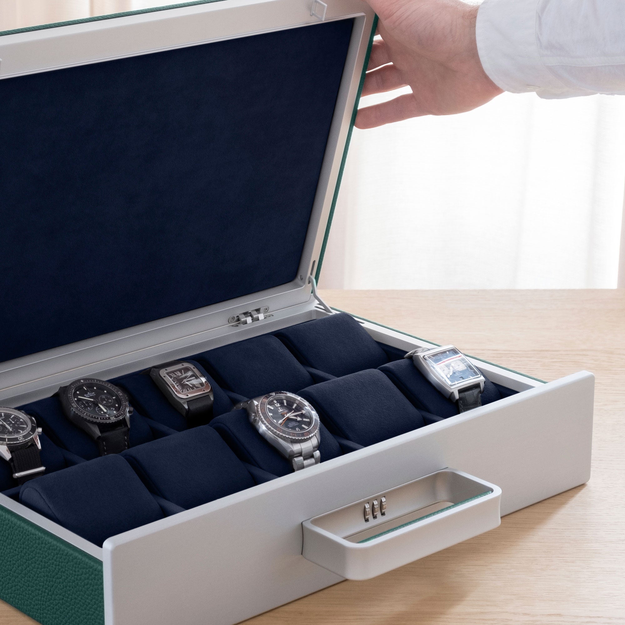 Lifestyle shot of Mackenzie Watch briefcase 10 filled with luxury watches including BlancPain, Cartier and Omega luxury watches