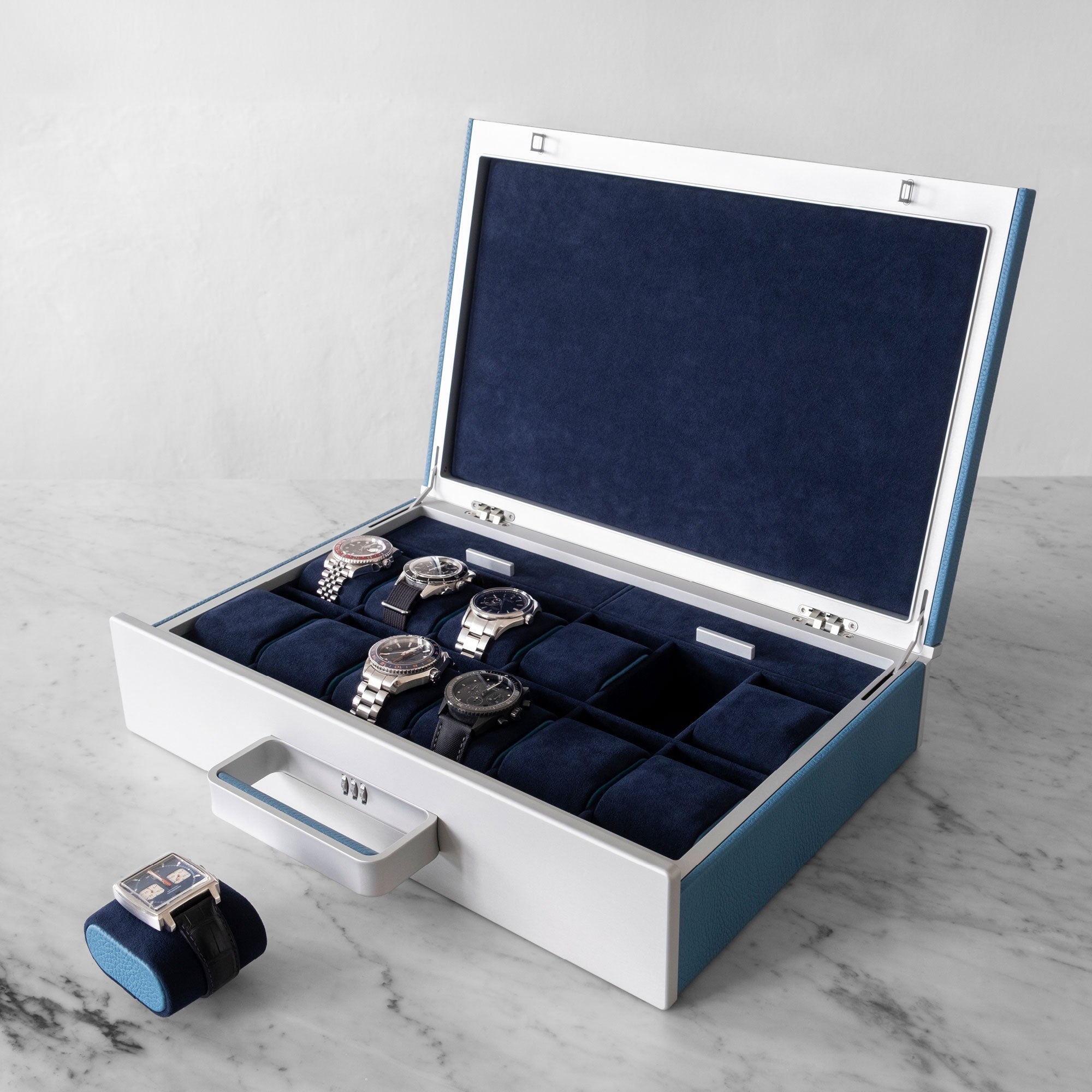 Designer Watch briefcase for 12 watches in sky blue leather, carbon fiber and grey anodized aluminum and deep blue Alcantara interior with luxury watches including Tag Heuer, Rolex, Blancpain and Omega