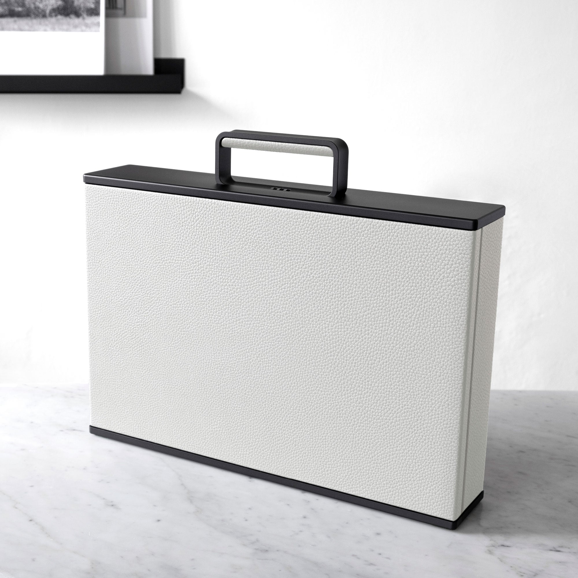 Lifestyle shot of Charles Simon Briefcases in white leather made by hand in Canada